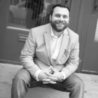 Black and white photo of consultant Aaron Ludin