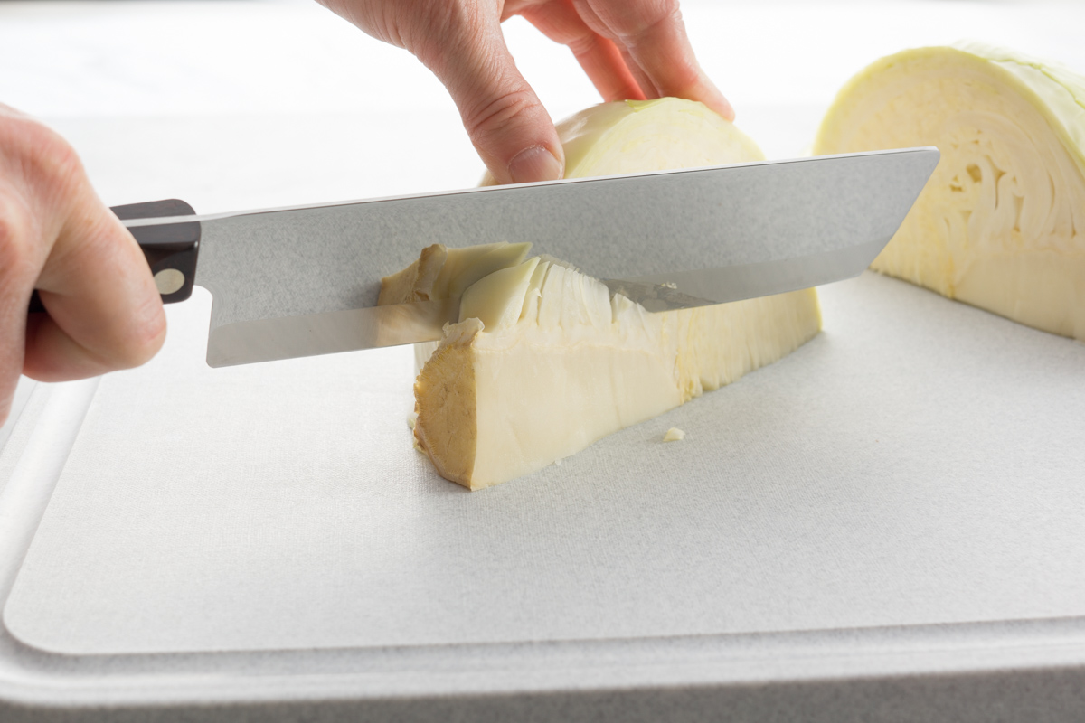 Using a Vegetable Knife to cut out the core.