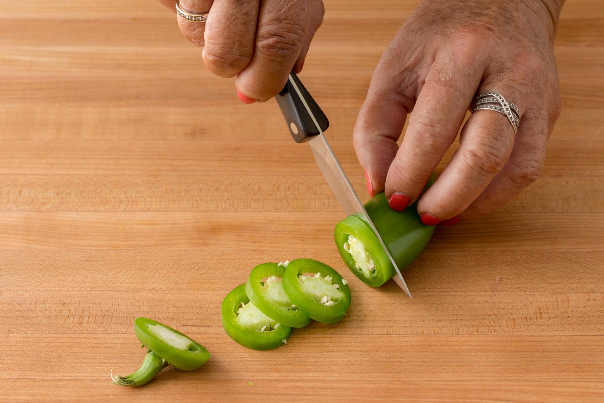 Slicing the jalapenos with a 3 Inch Gourmet Paring Knife.