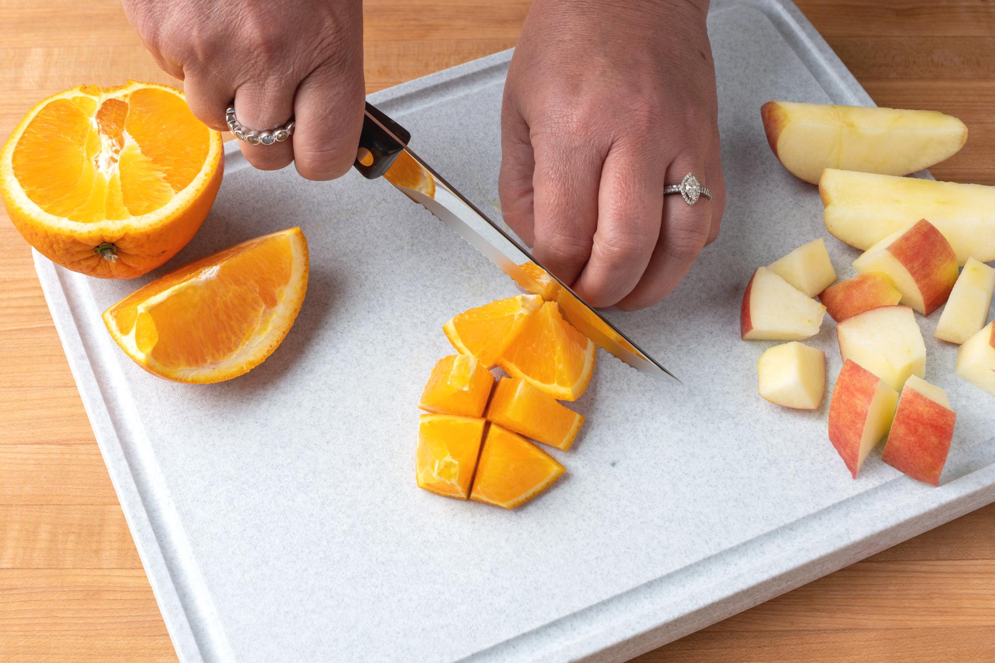 Use the Trimmer to cut the orange into chunks.