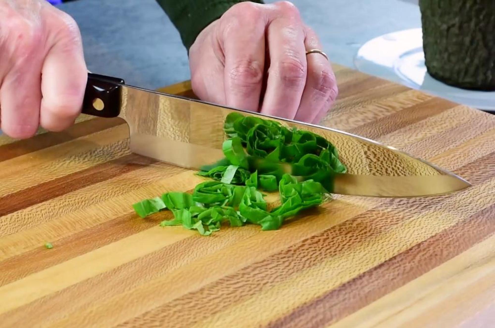 The Petite Chef being used to chop the basil.