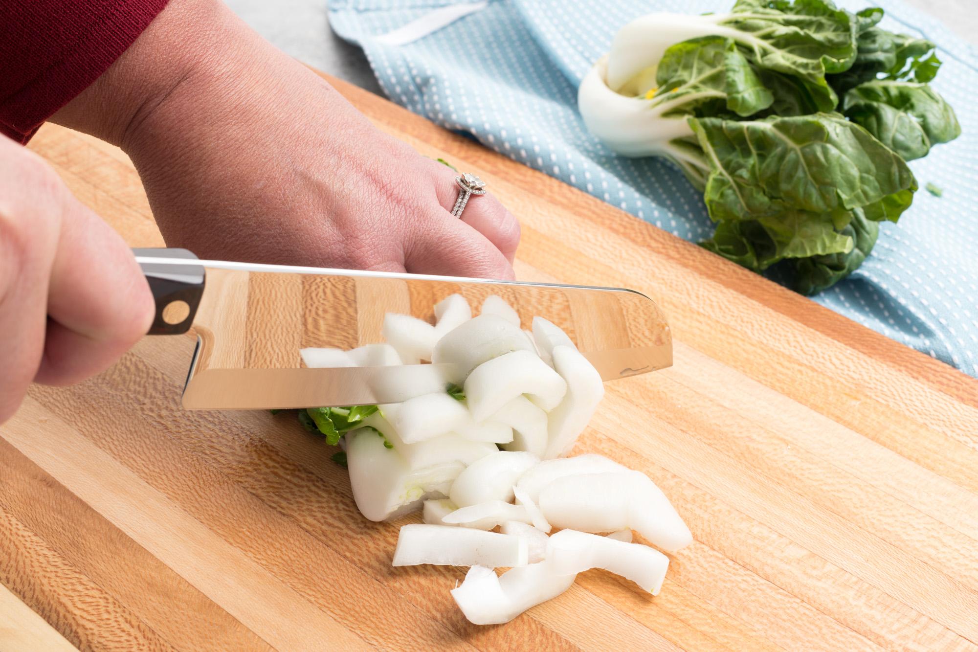 Chopped bok choy with a Santoku.