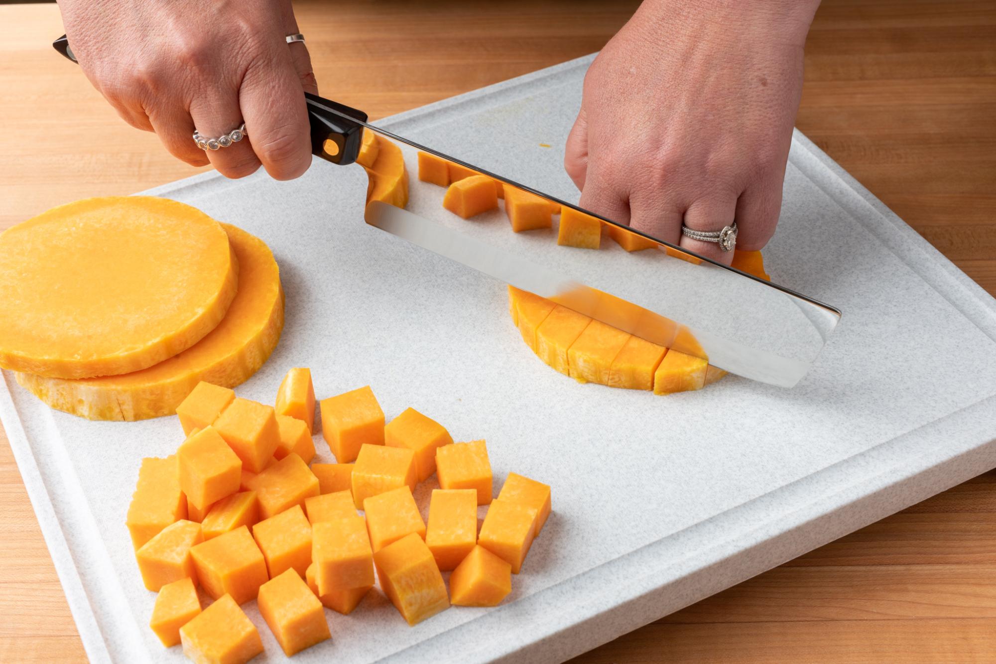 Dicing the butternut squash with a Vegetable Knife.