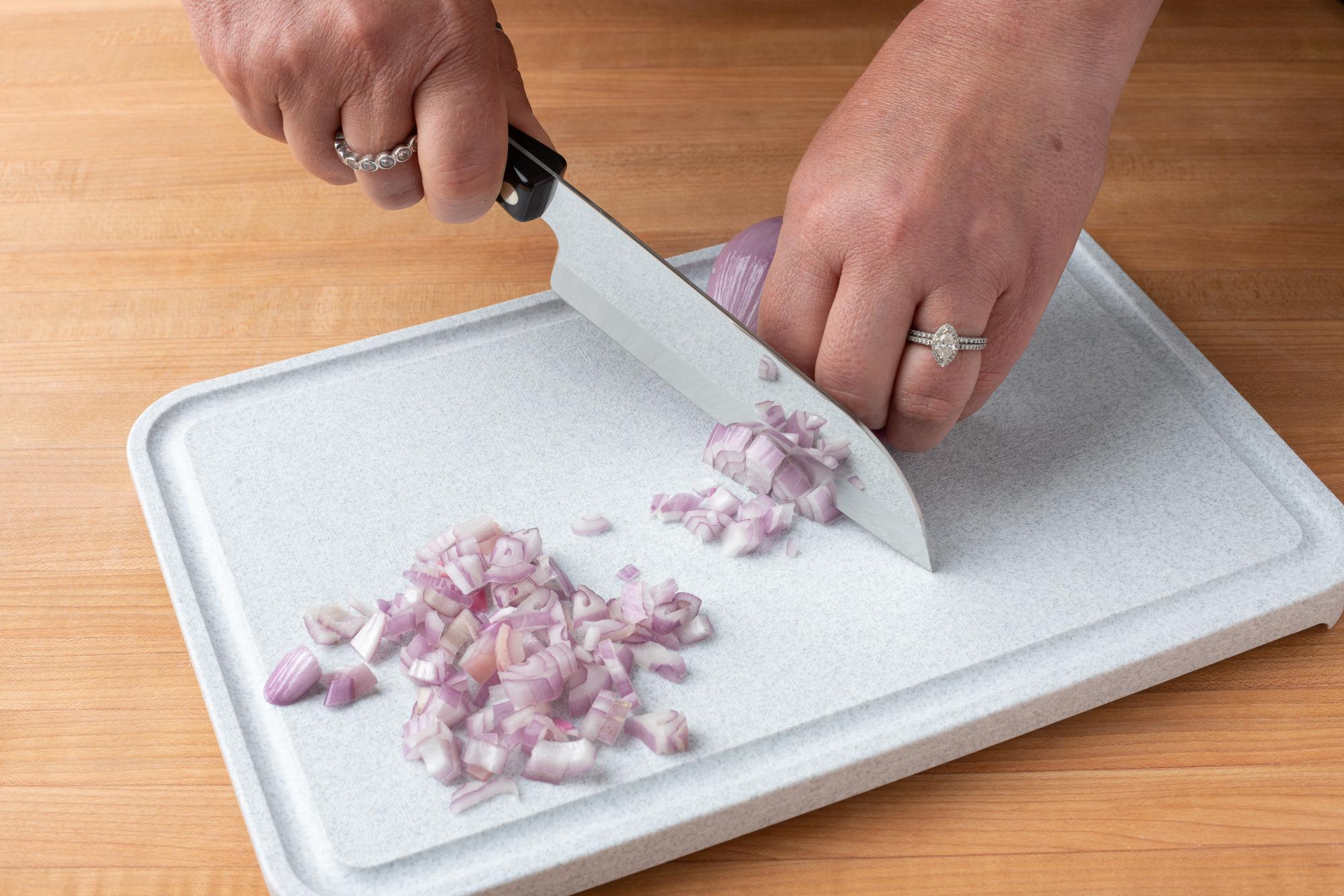 Mincing the shallot with a Petite Santoku.