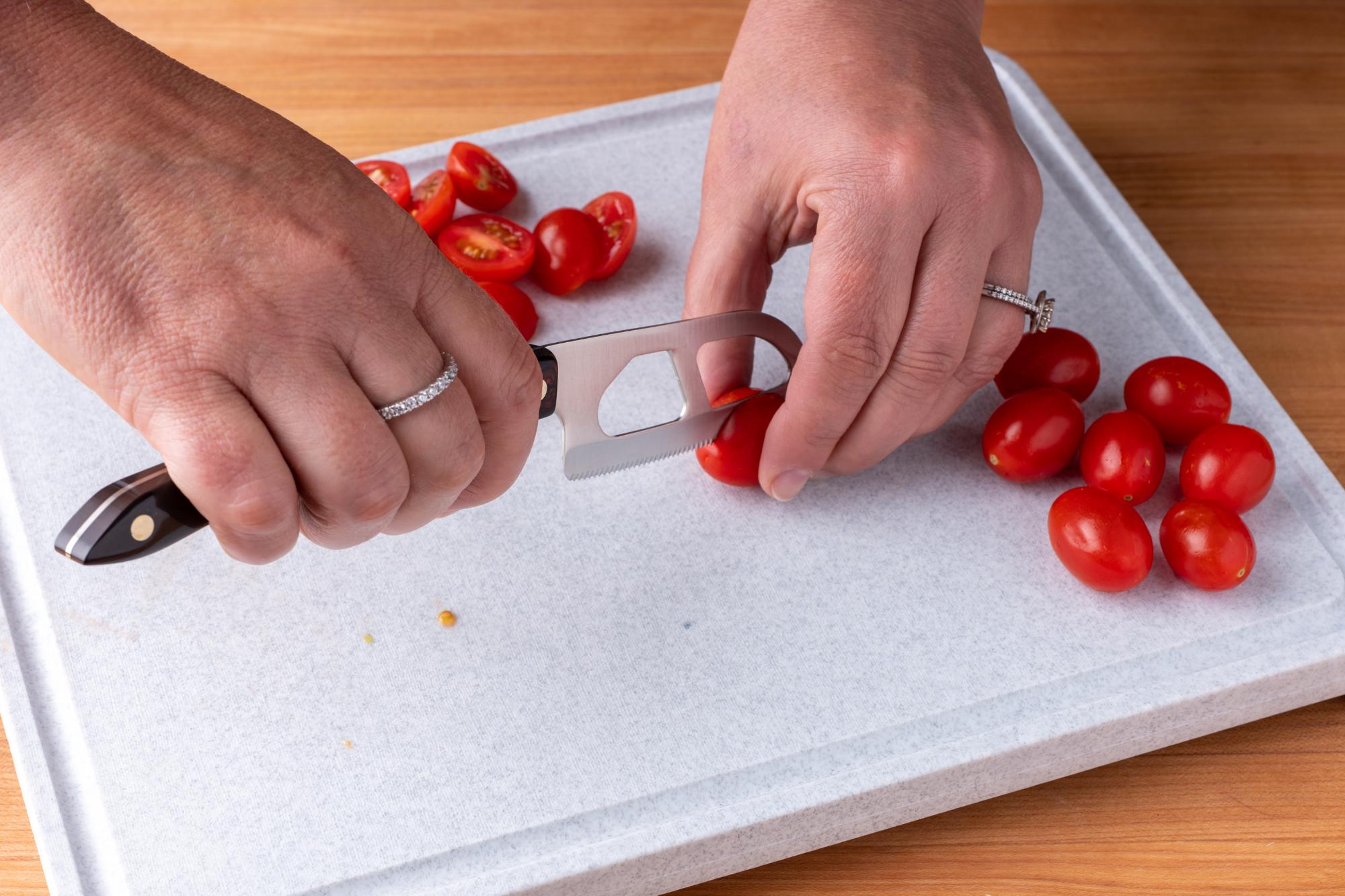 The Santoku-Style Cheese knife is perfect for halving tomatoes.