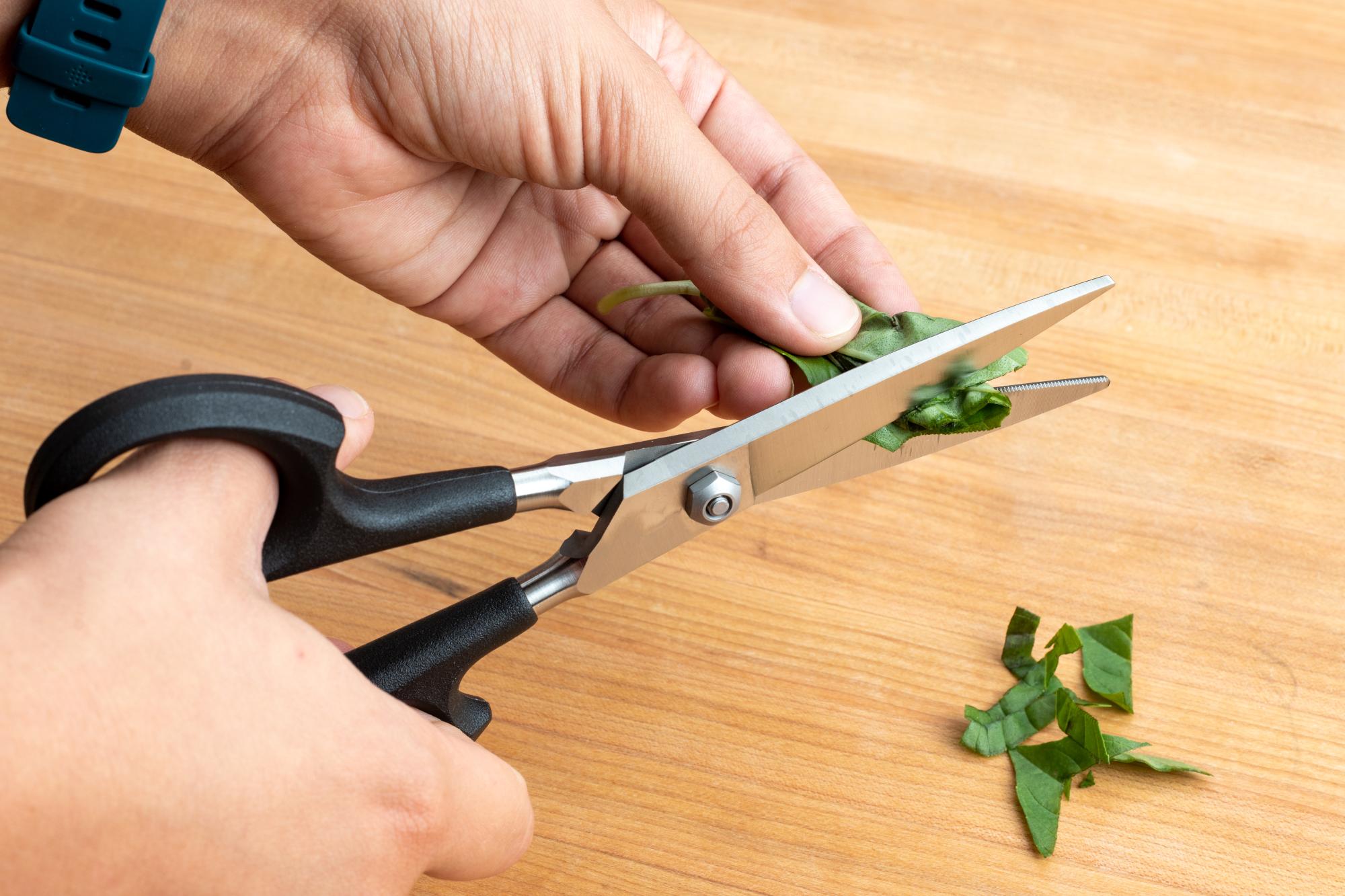 Using the Super Shears to snip the basil into strips.
