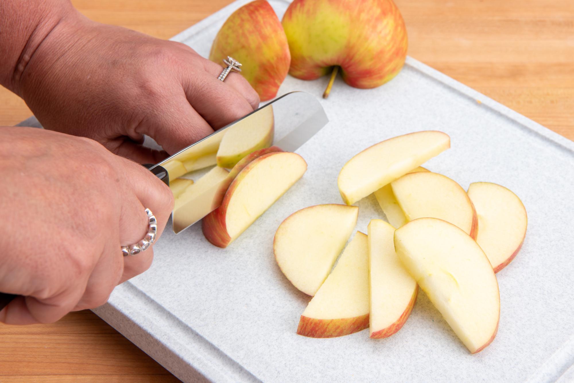 Using the Petite Santoku to slice the apples.