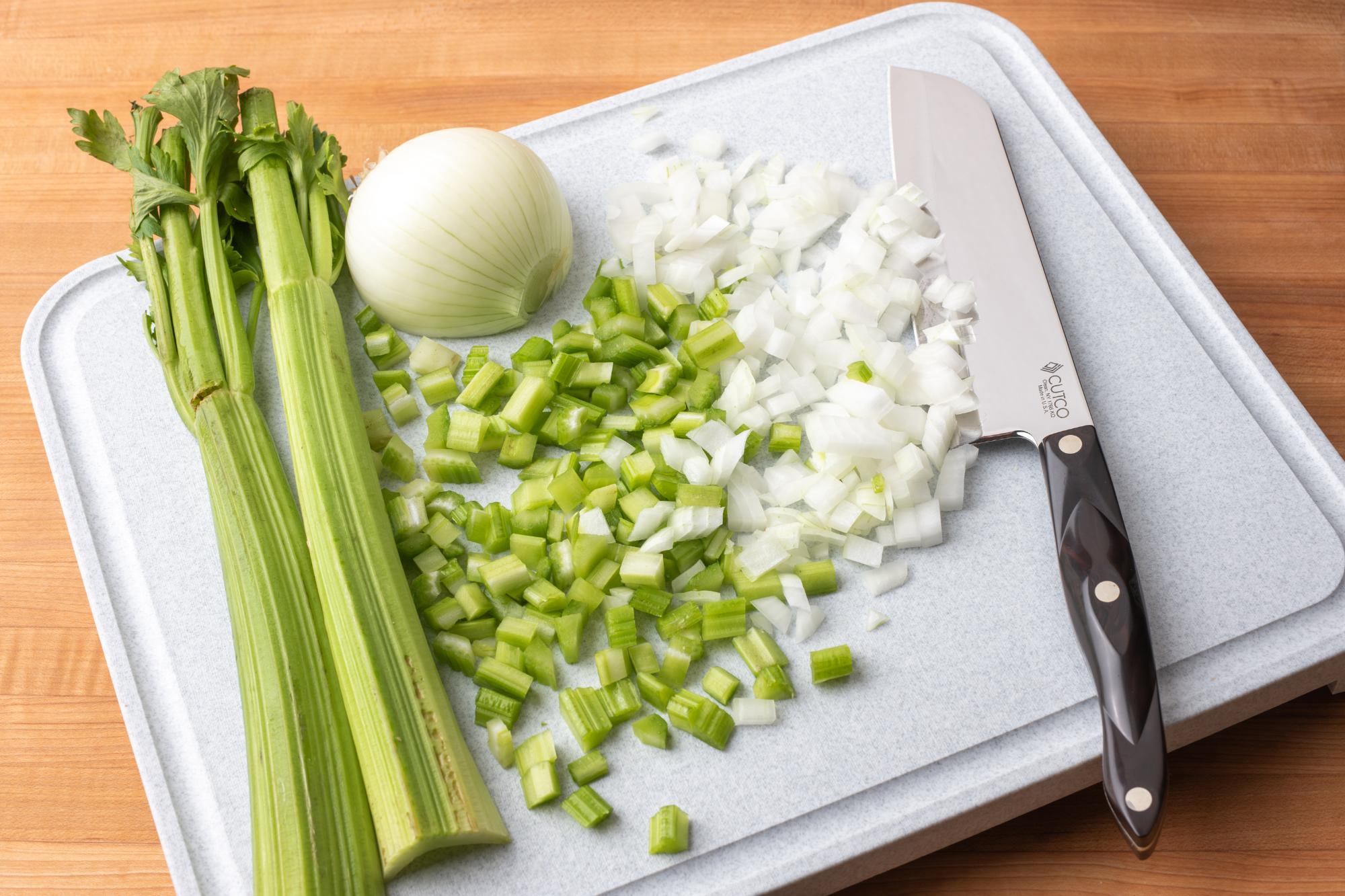 Diced celery and onion with a Santoku knife.