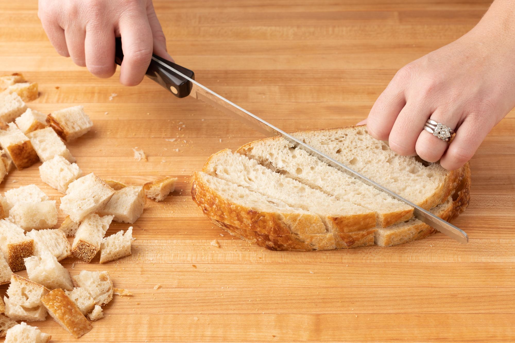Cutco's 9-3/4 Inch Slicer effortlessly cubes the bread.