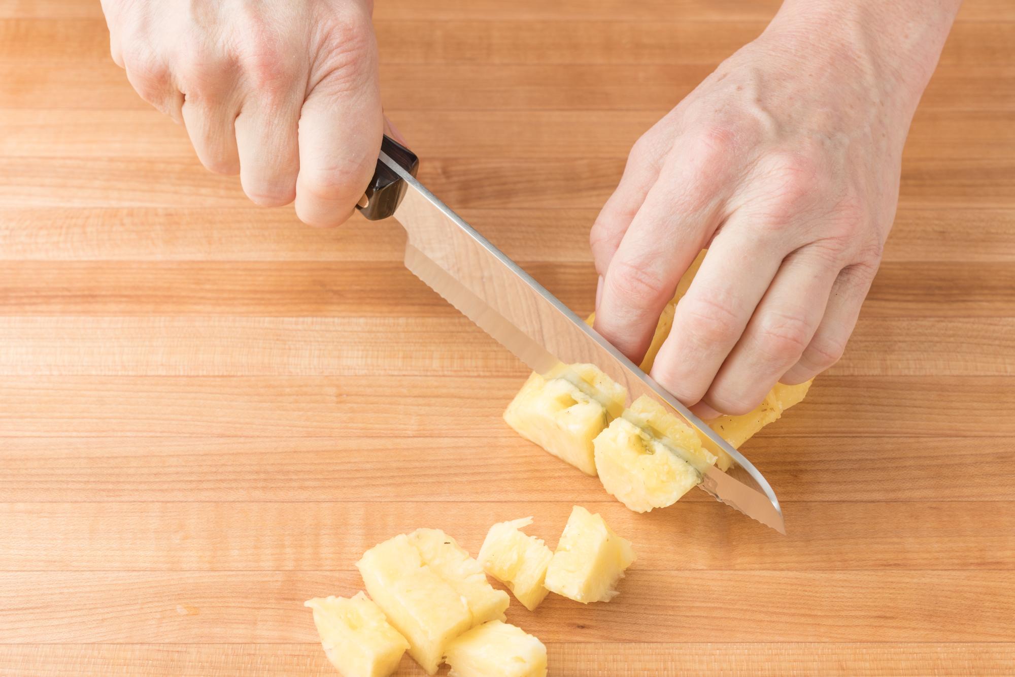 Dicing the pineapple with a Hardy Slicer.