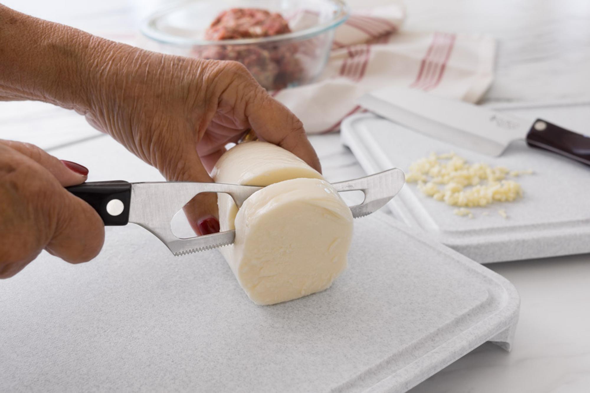 Sliceing fresh mozzarella with a Traditional Cheese Knife.