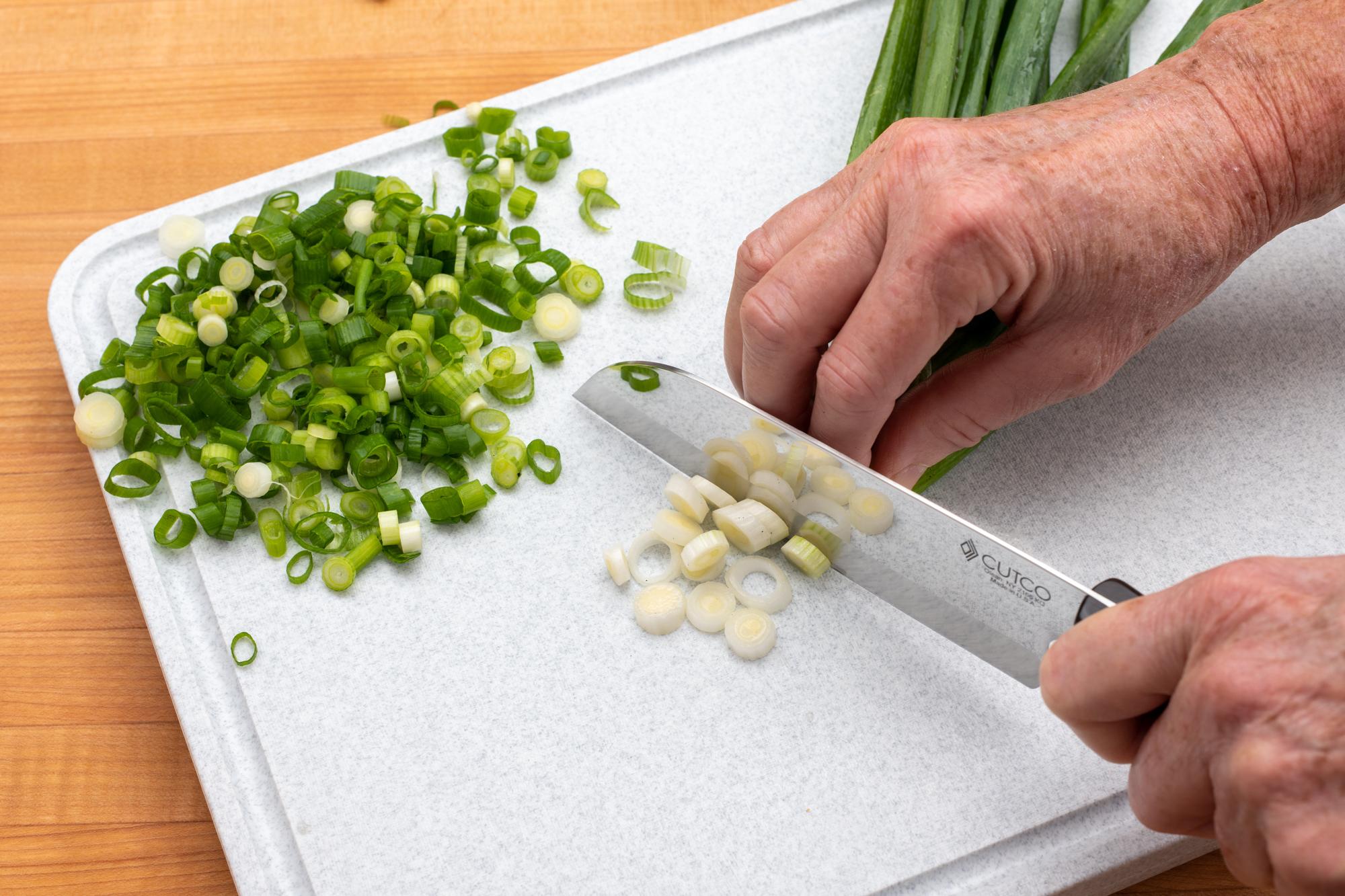 Slicing green onion with a Petite Santoku.