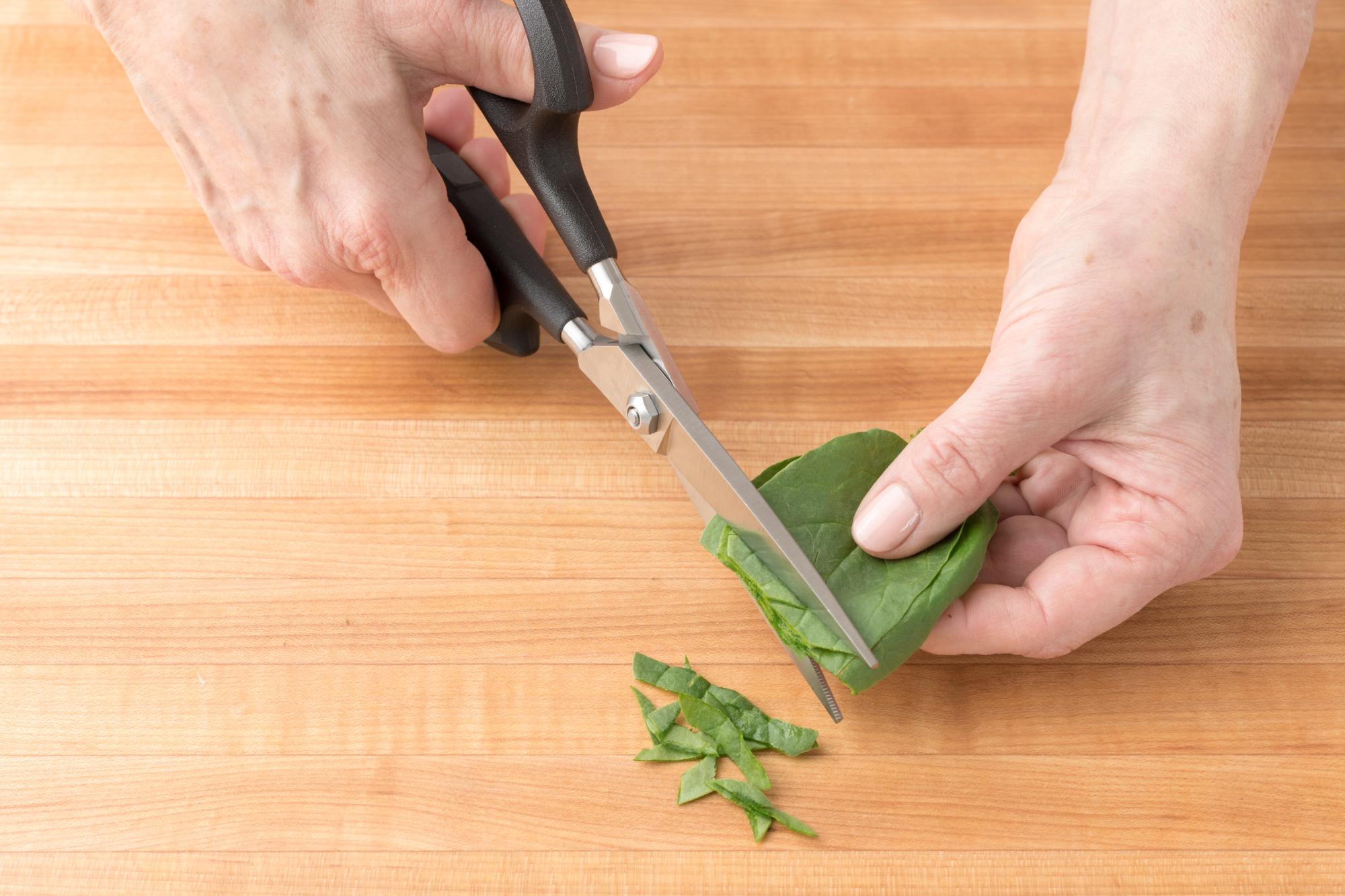 Using the Super Shears to trim the baby spinach.