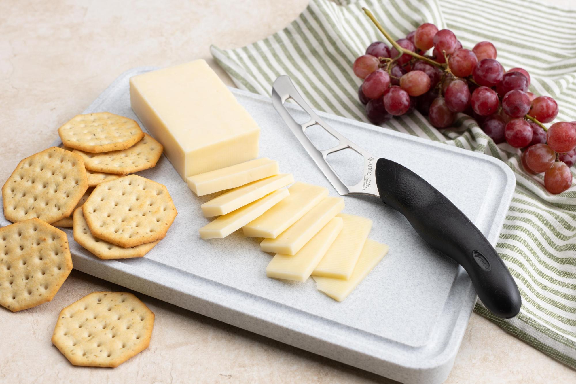 Gadget-style Cheese Knife with sliced cheese.