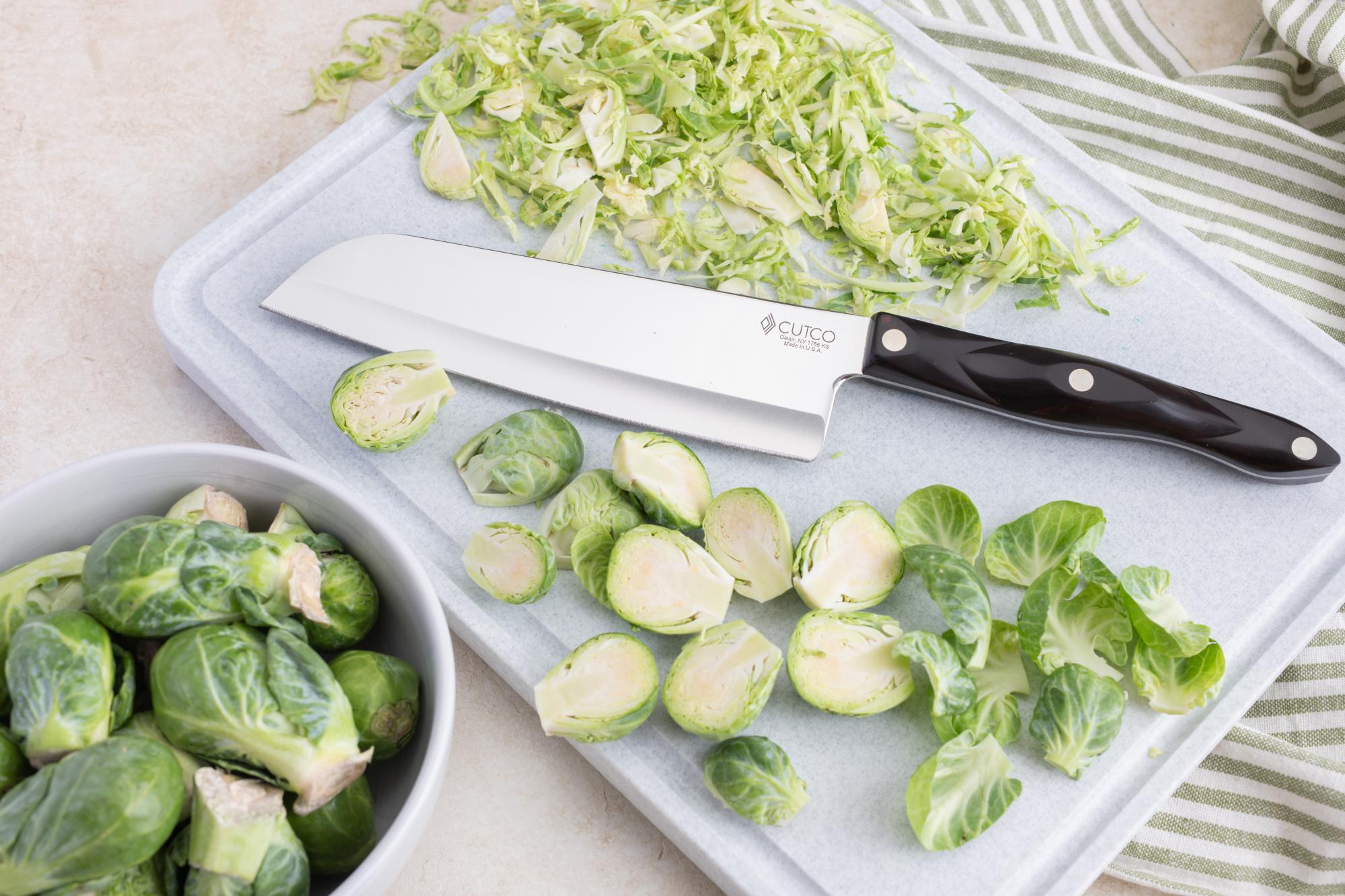 Slice the brussels sprouts with a Petite Santoku.
