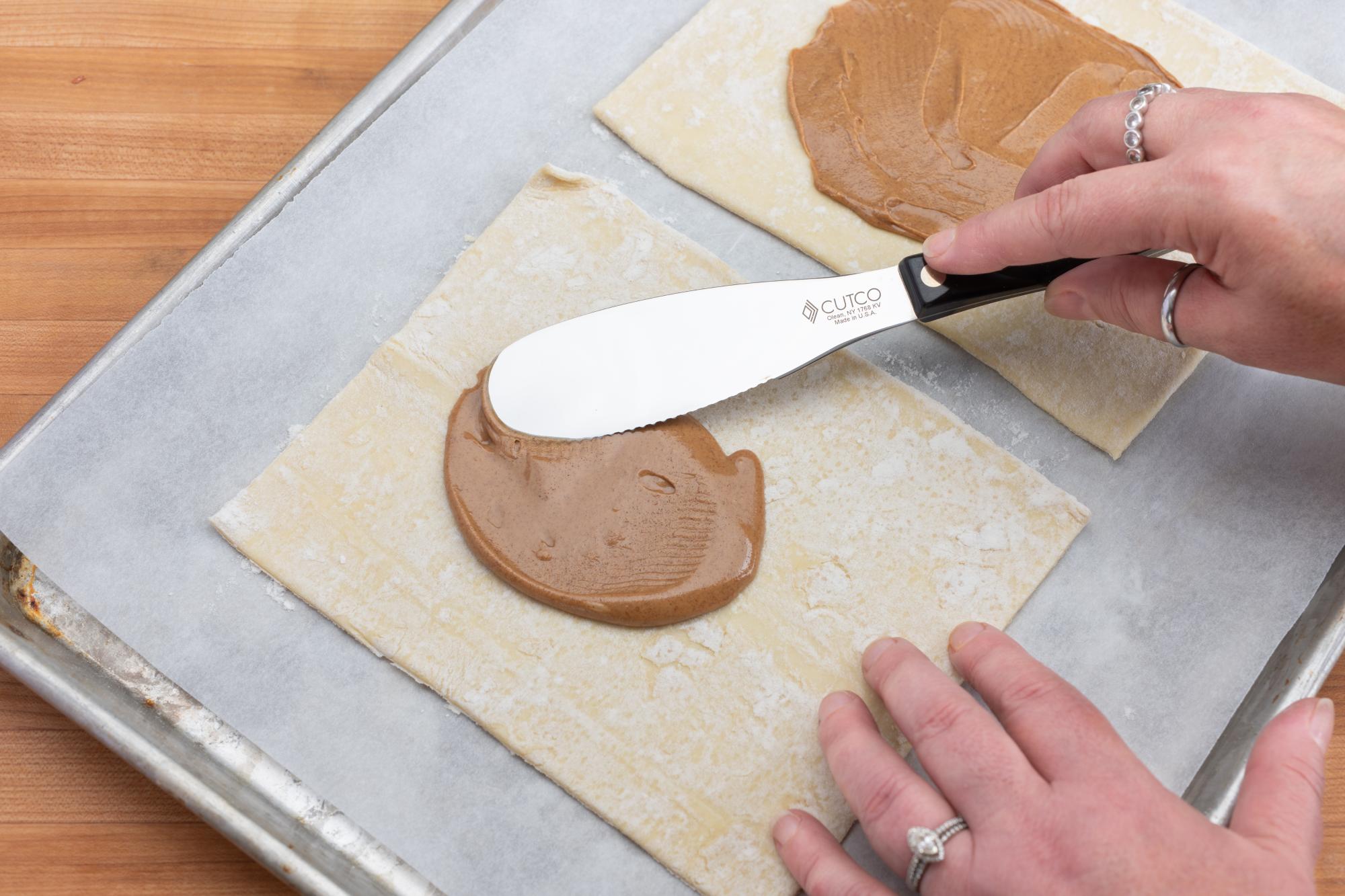 Using the Spatula Spreader to spread the almond butter.