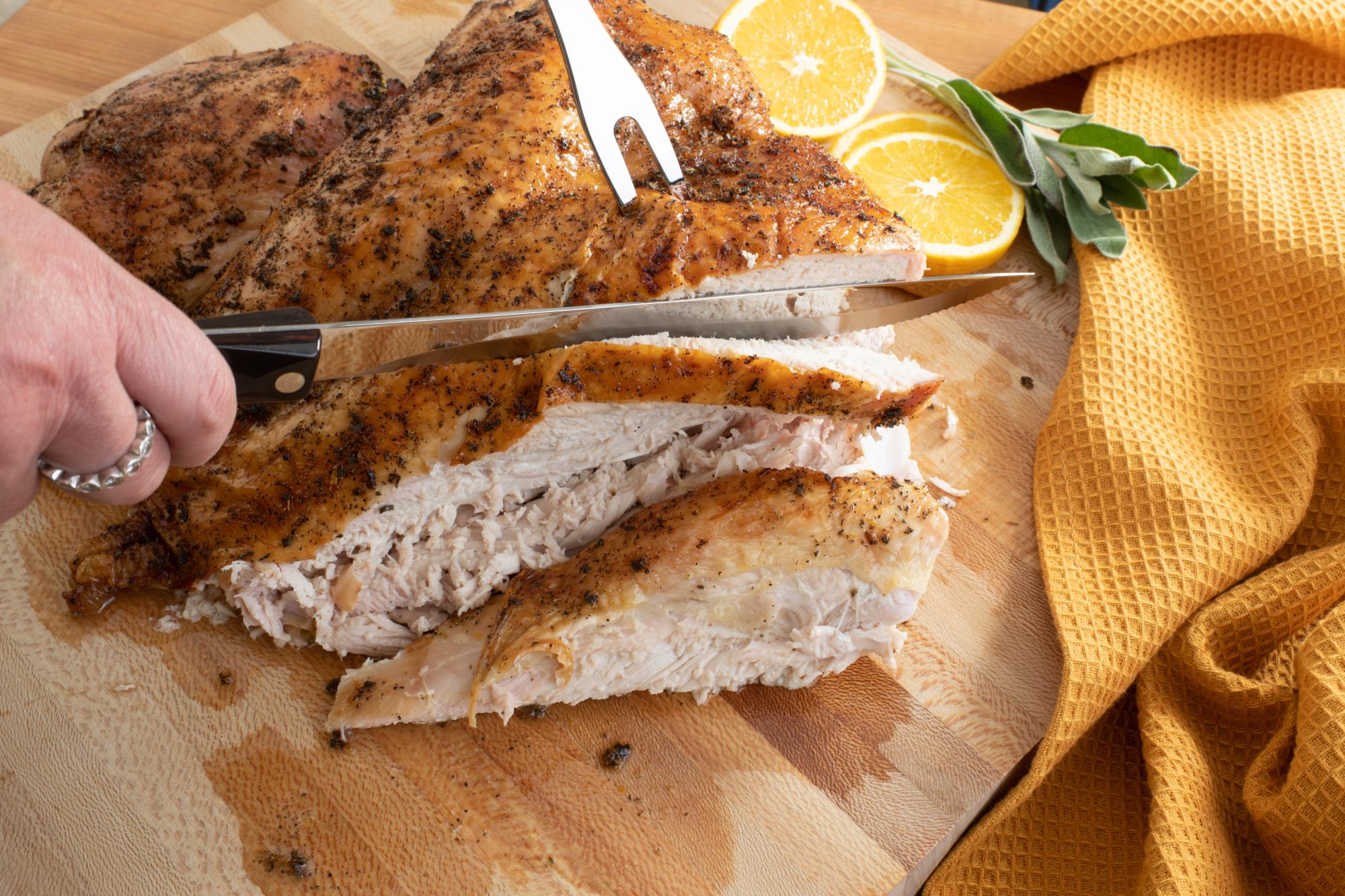 Using the Carving Knife and Fork to slice the turkey.