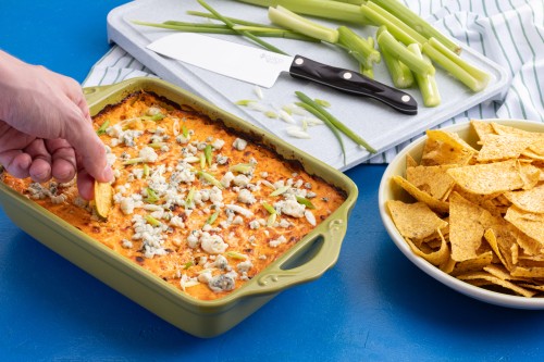 Buffalo Chicken Dip With Tortilla Chips and Celery