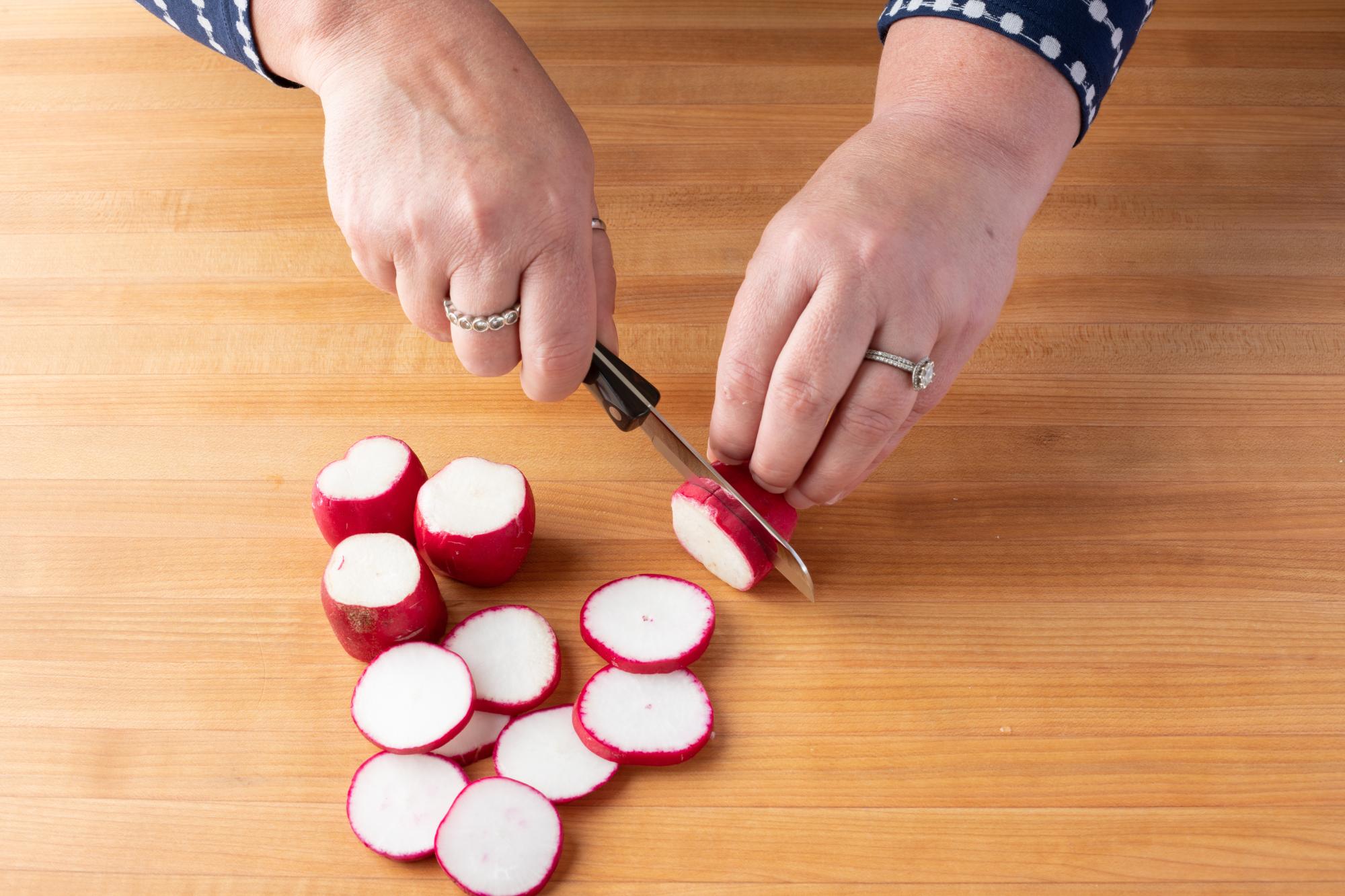 Slicing the radish with a Santoku-Style Paring Knife.