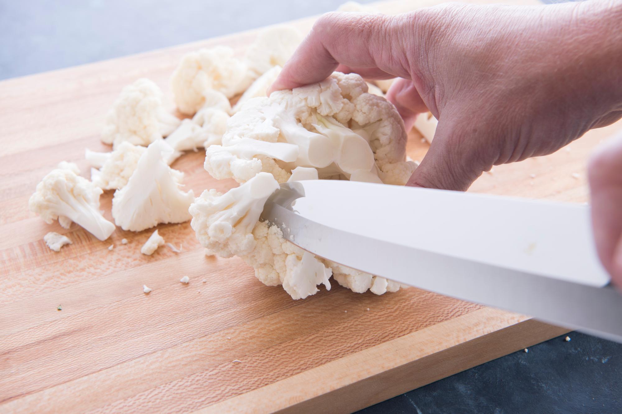 Cutting the cauliflower with a Petite Chef.