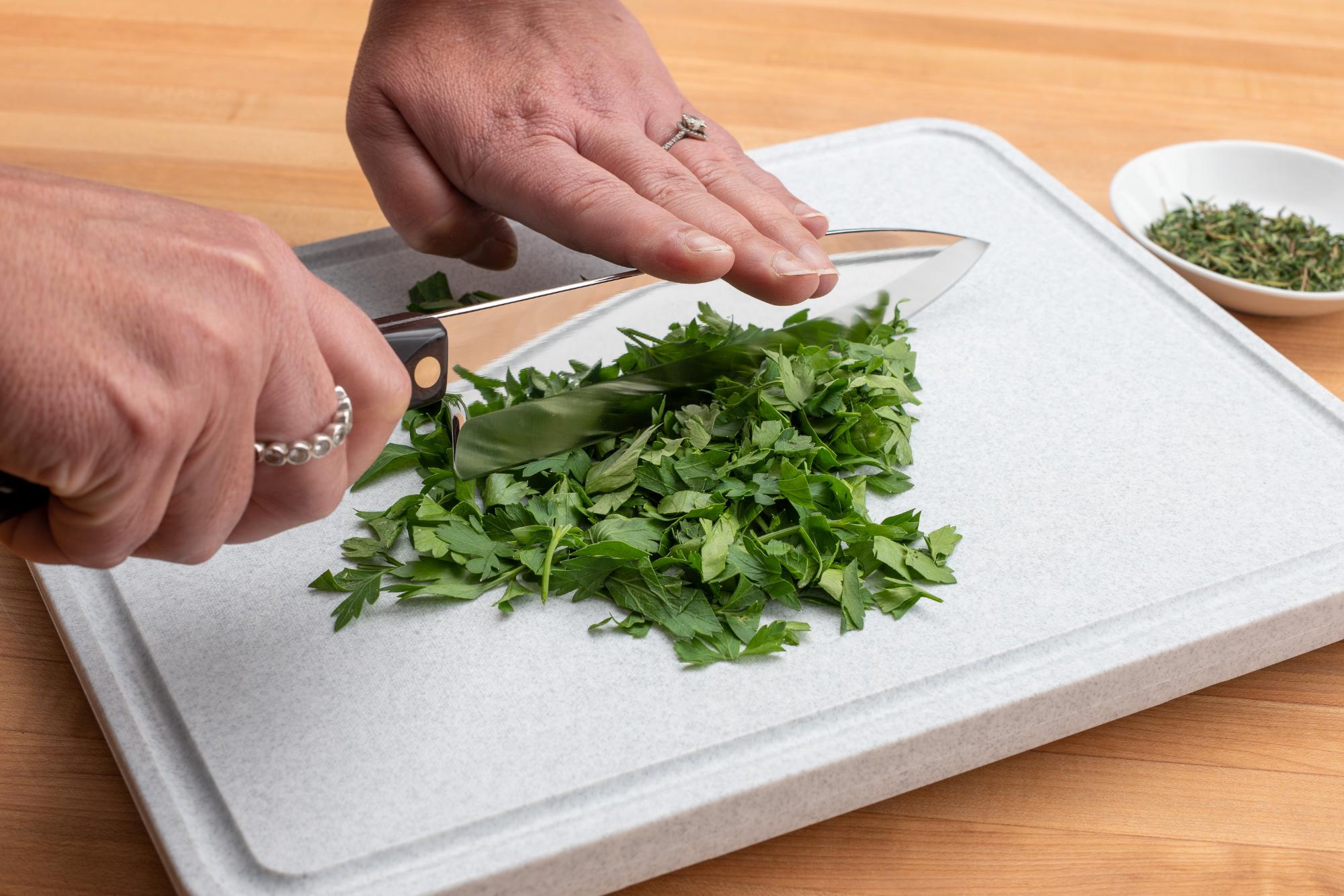 Chopping the herbs.