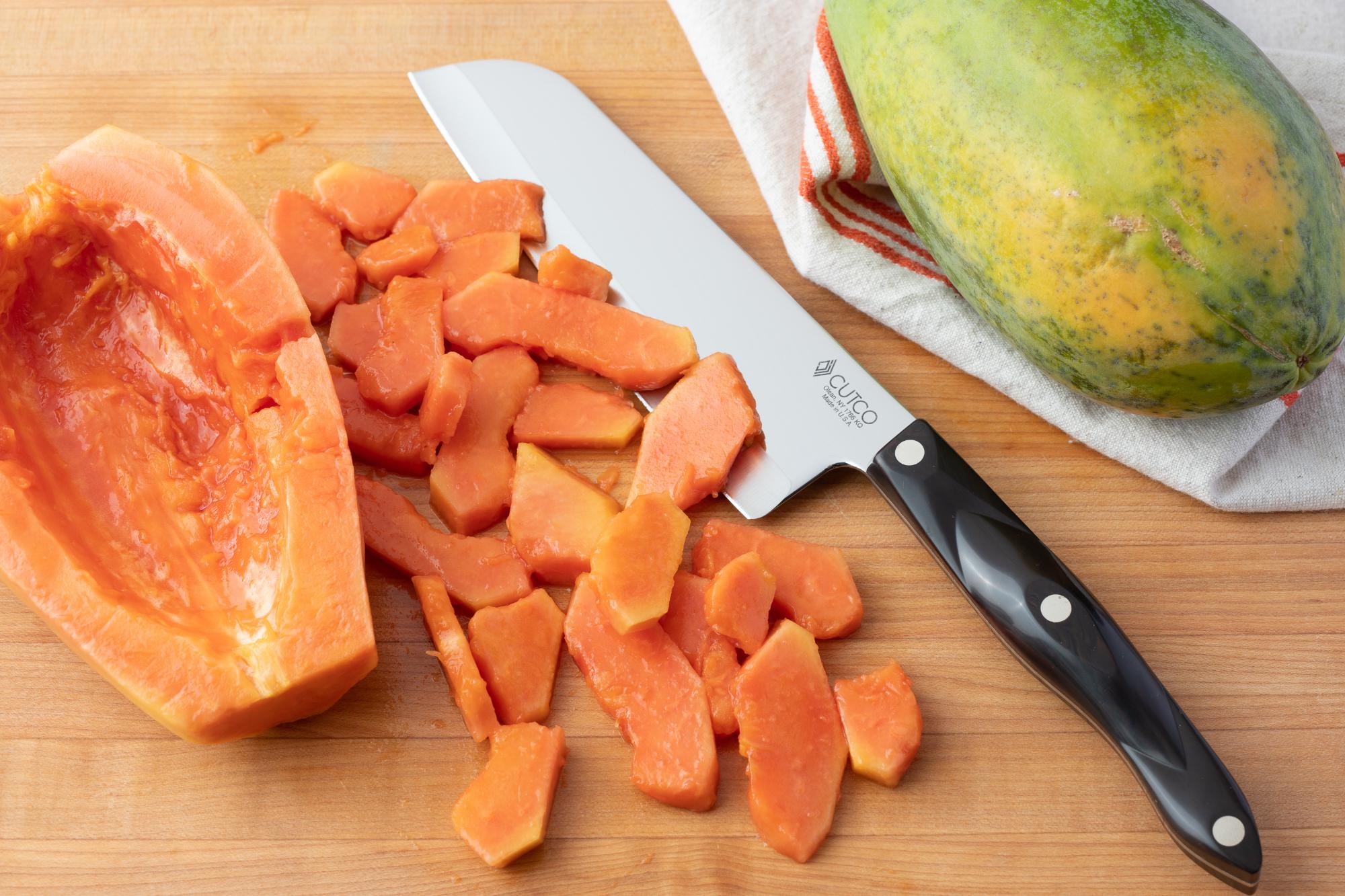 Santoku with sliced papaya.