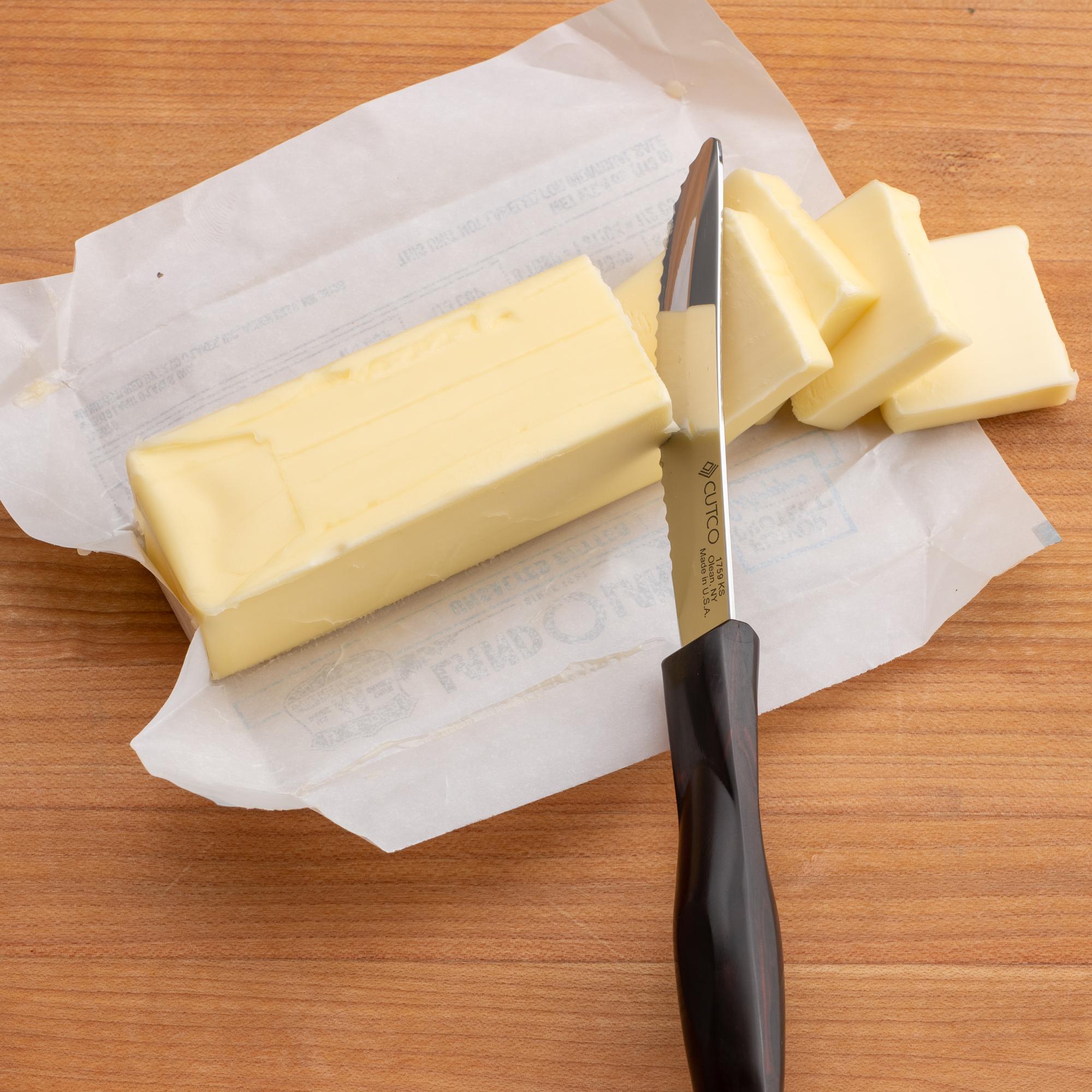 Sliced pads of butter with a Table Knife.