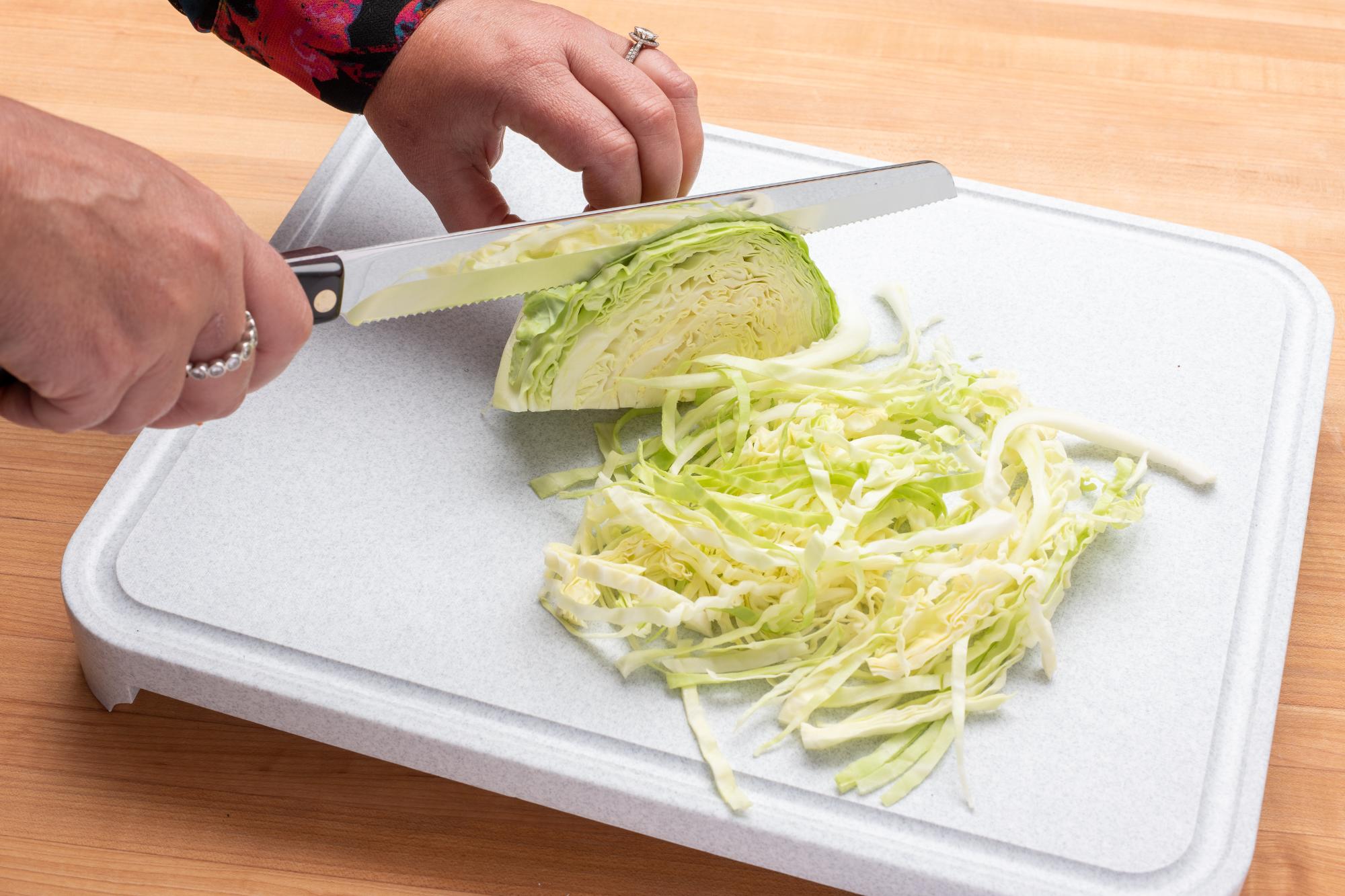 Shredding the cabbage with the Santoku-Style Slicer.