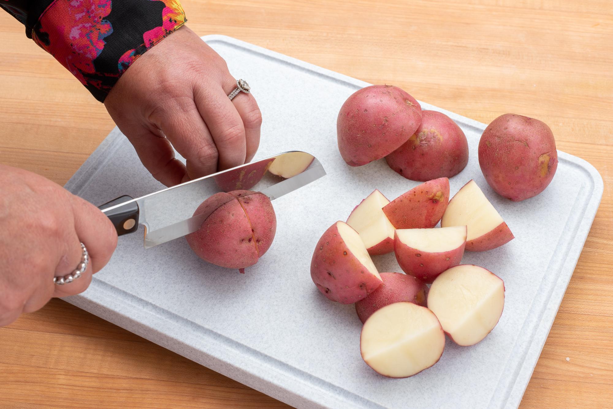 Cutting the red potatoes with a Petite Santoku