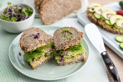 Green Sandwich With Cucumber, Avocado, Sprouts and Chickpea Spread