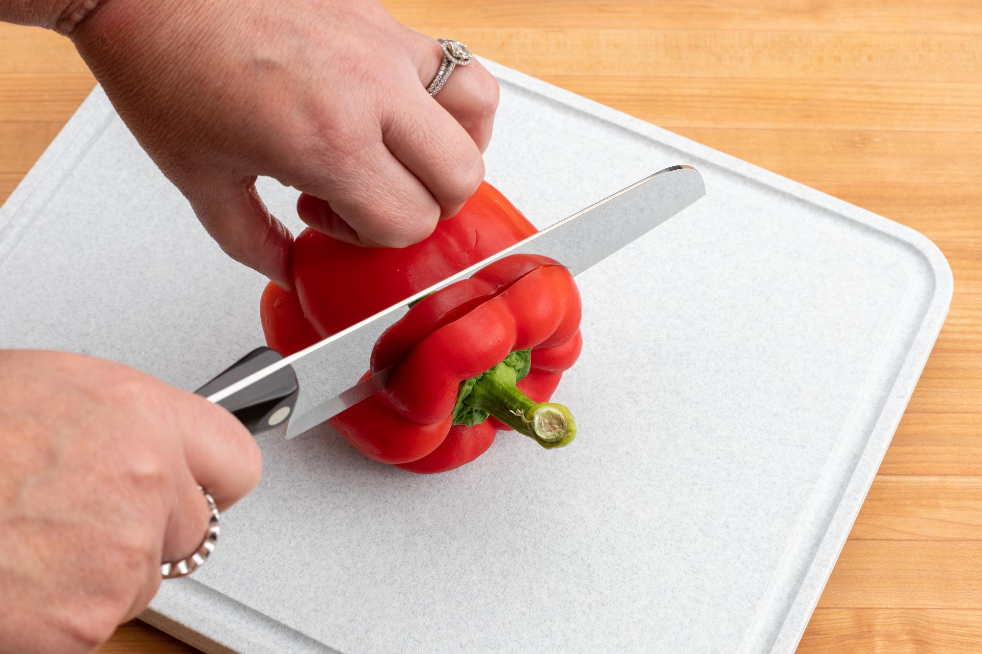 Slicing the red pepper with a Santoku.