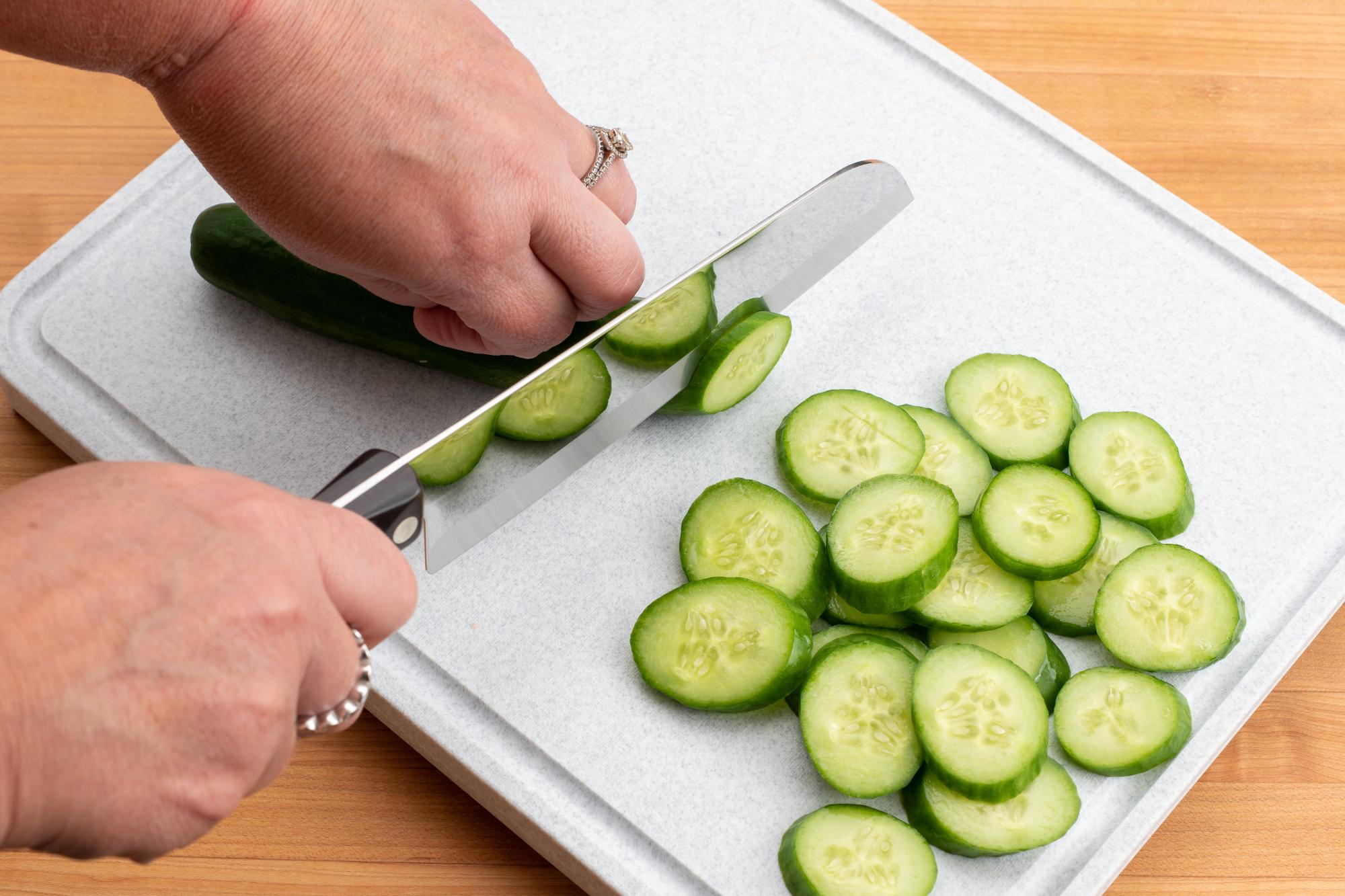 Sliced cucumber with a Santoku.