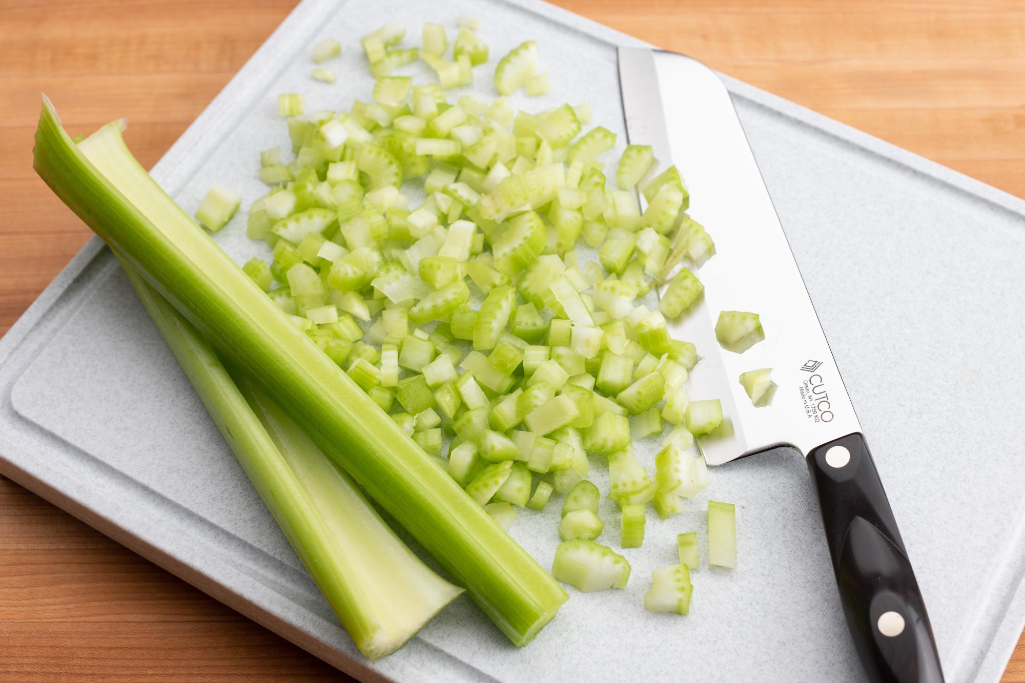 Chop the celery with a Santoku.