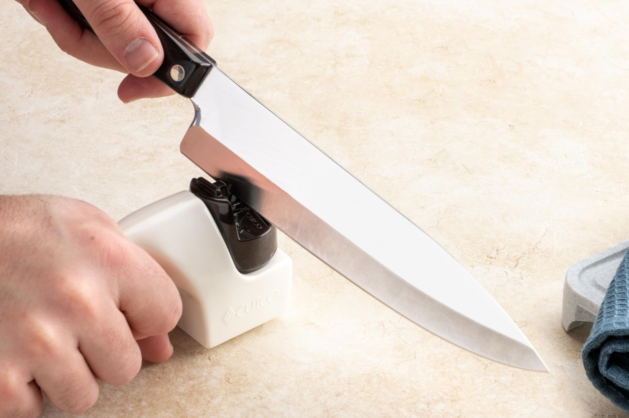 Using a sharpener to sharpen a Petite Chef.