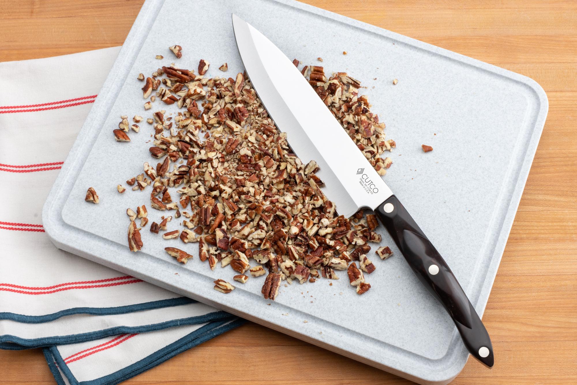 Rough-chopped pecans with the 7-5/8-Inch Petite Chef knife.