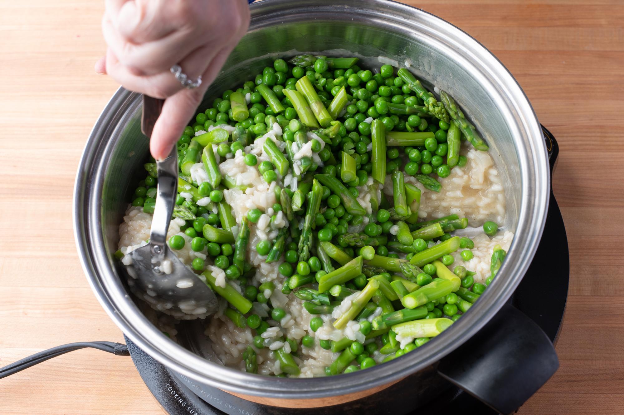 Adding in the peas and beans.
