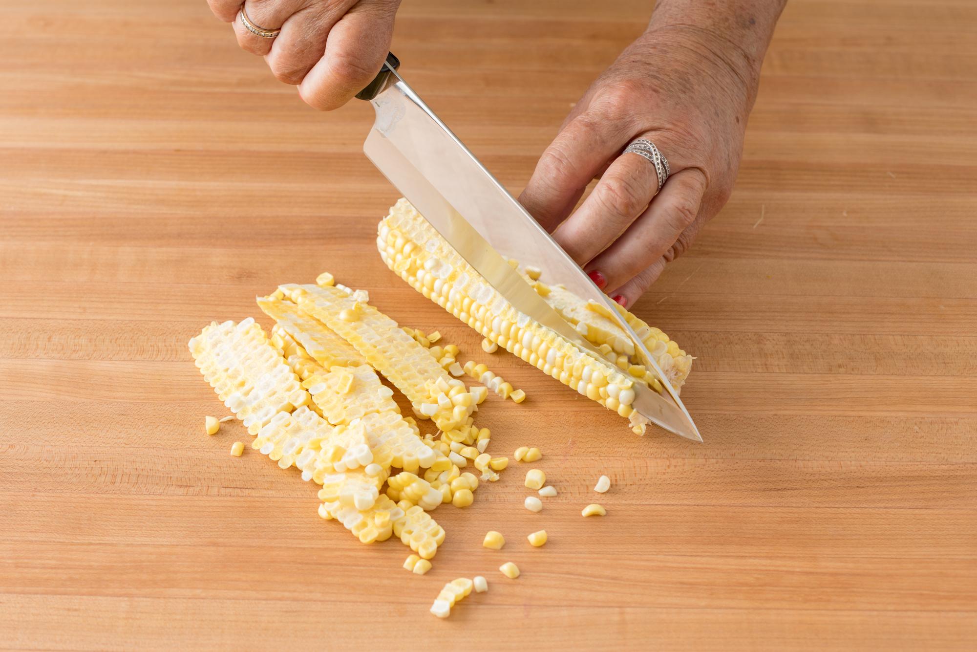 Slicing the corn from the cob with a Petite Chef.