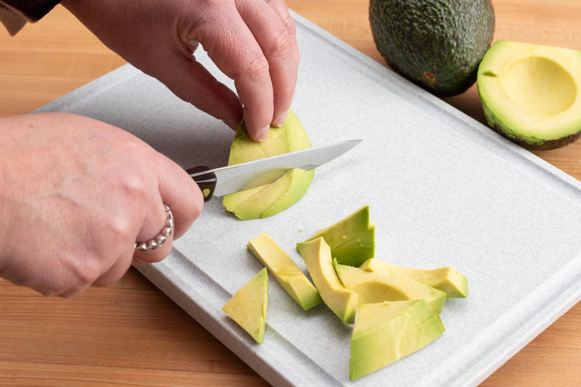 Slicing the avocado with a 4 Inch Gourmet Paring Knife
