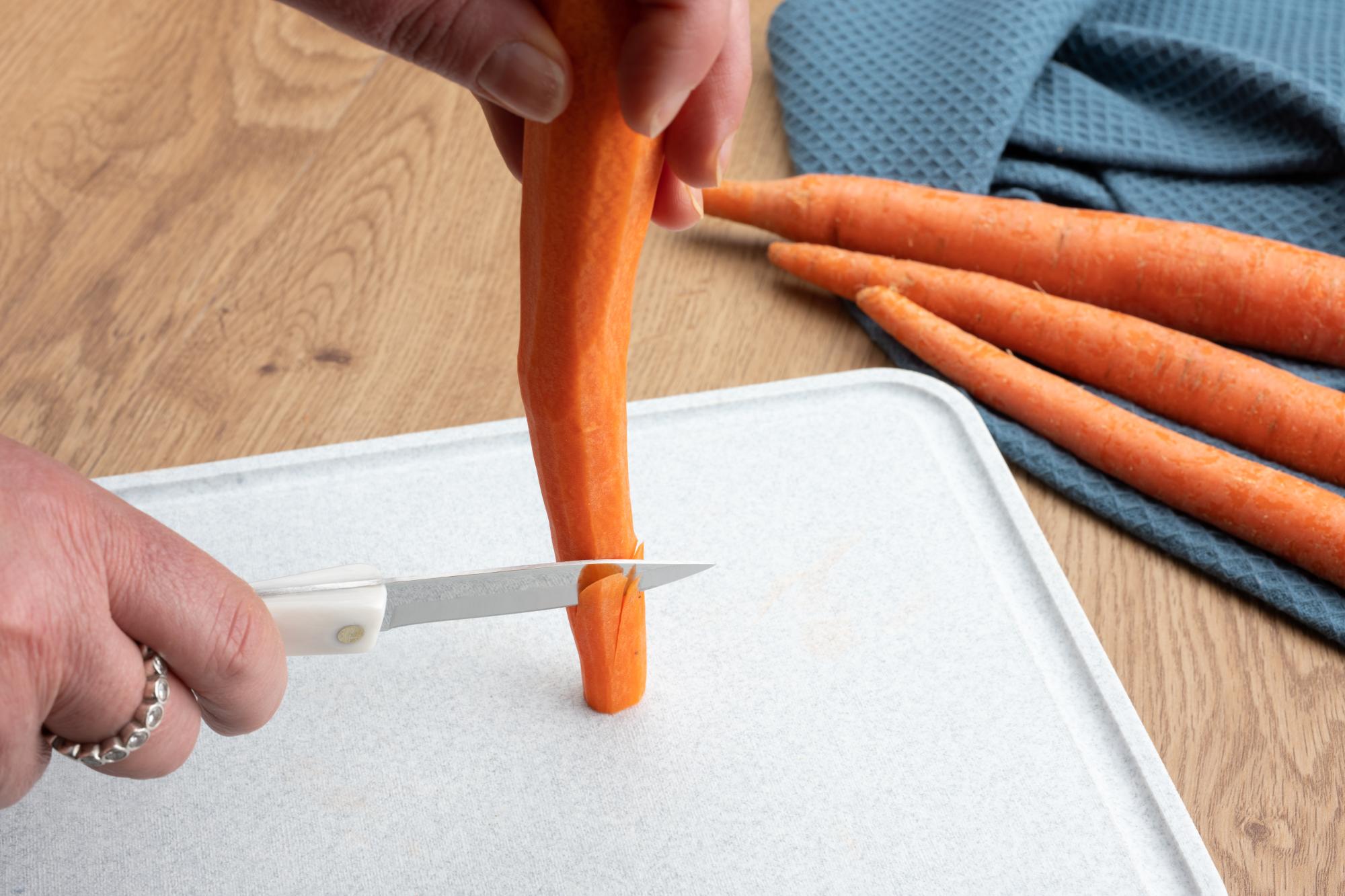 Making the angled cuts in the carrot.