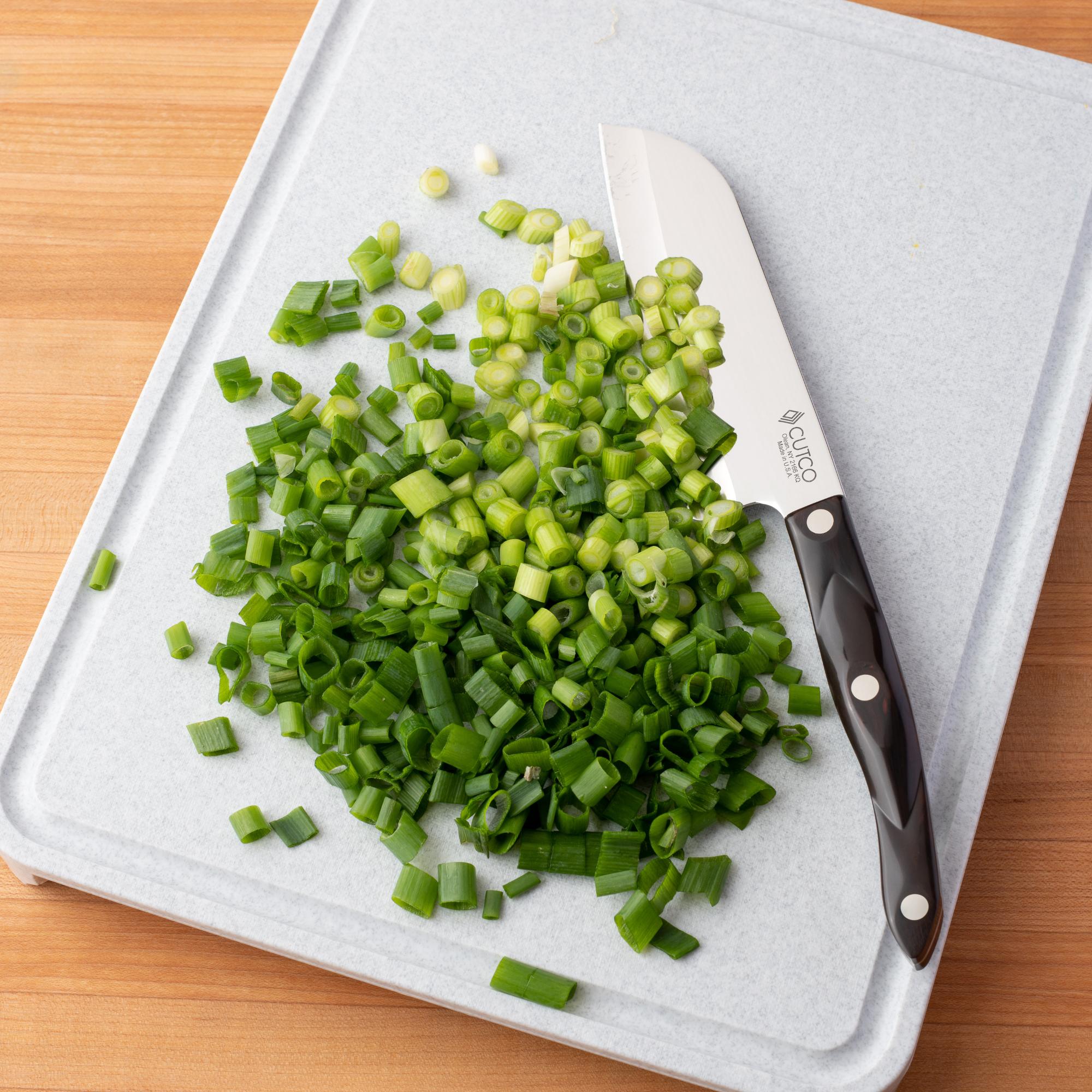 Petite Santoku with chopped scallions.