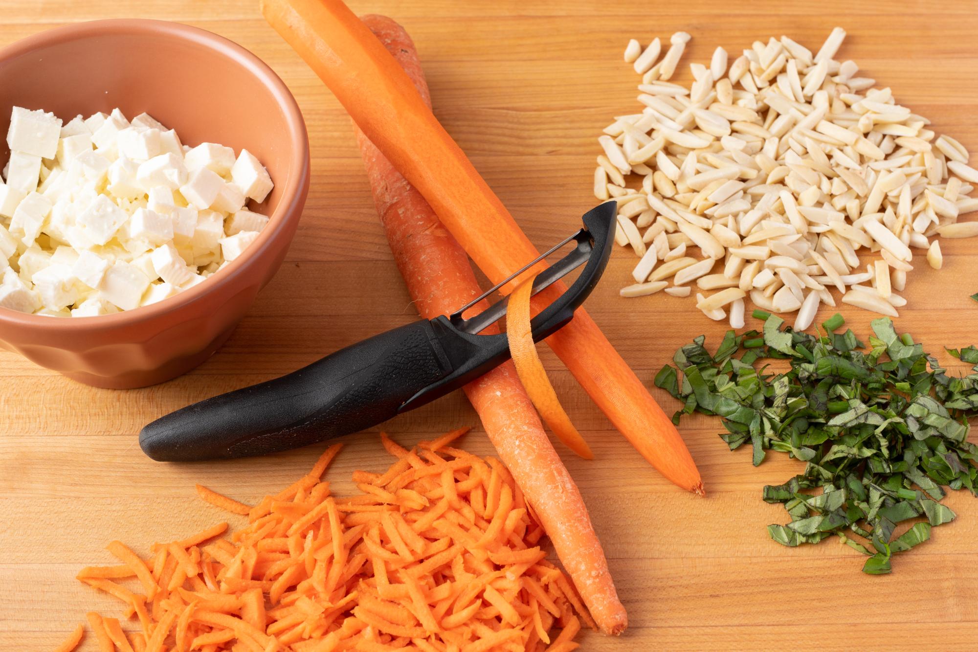 Peel the carrots with the Vegetable Peeler.