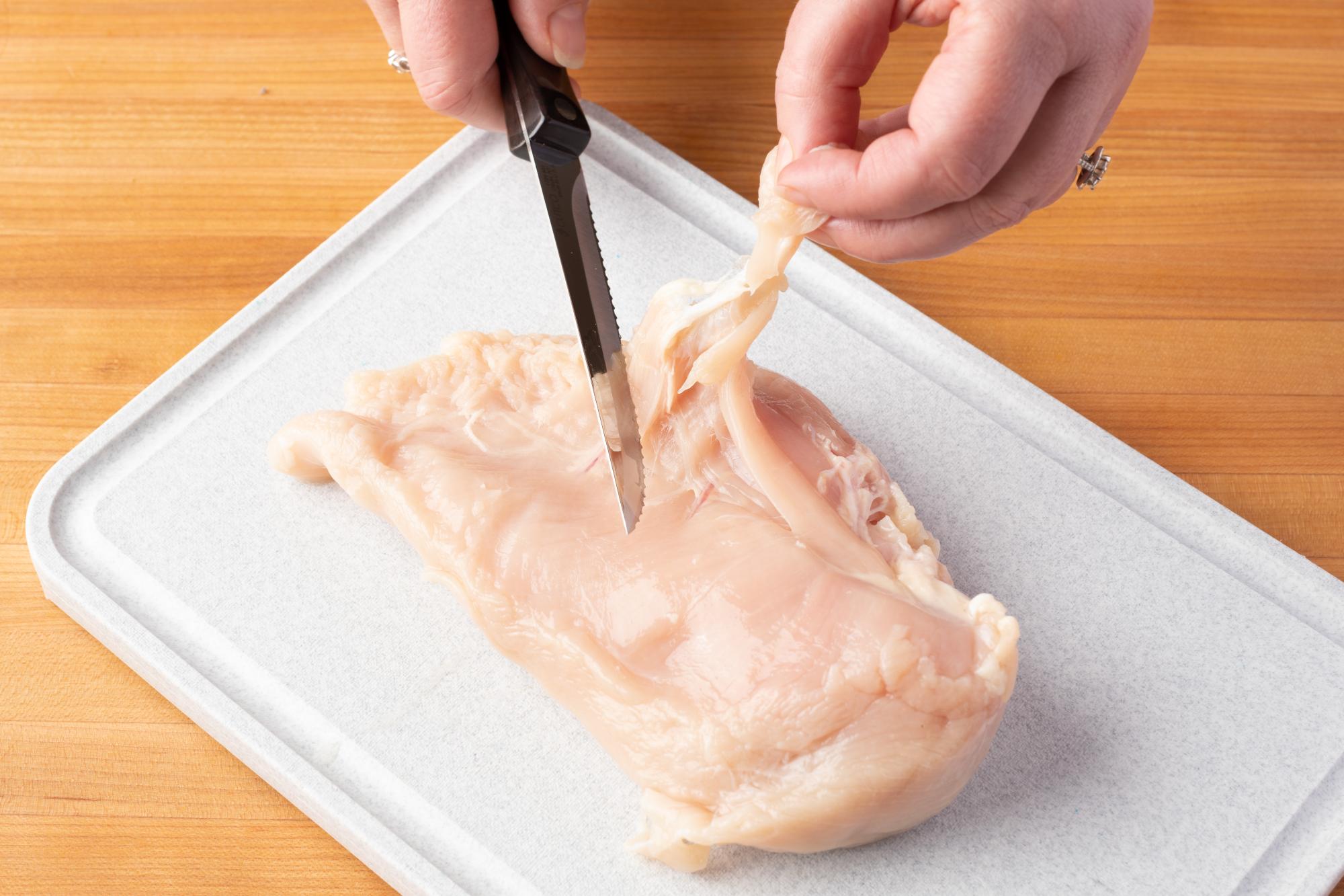 Trim excess fat off the chicken with a Trimmer.