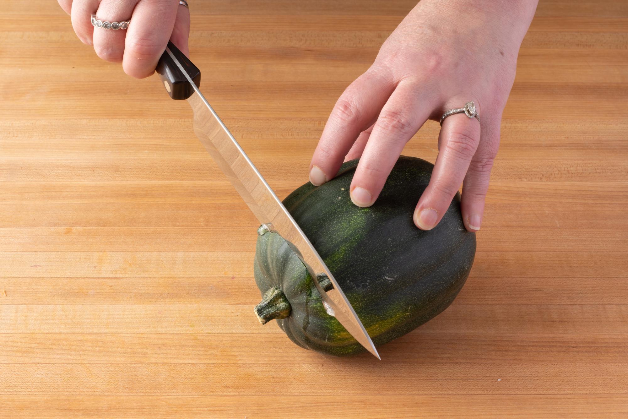 Slicing the stem side with a Petite Chef.