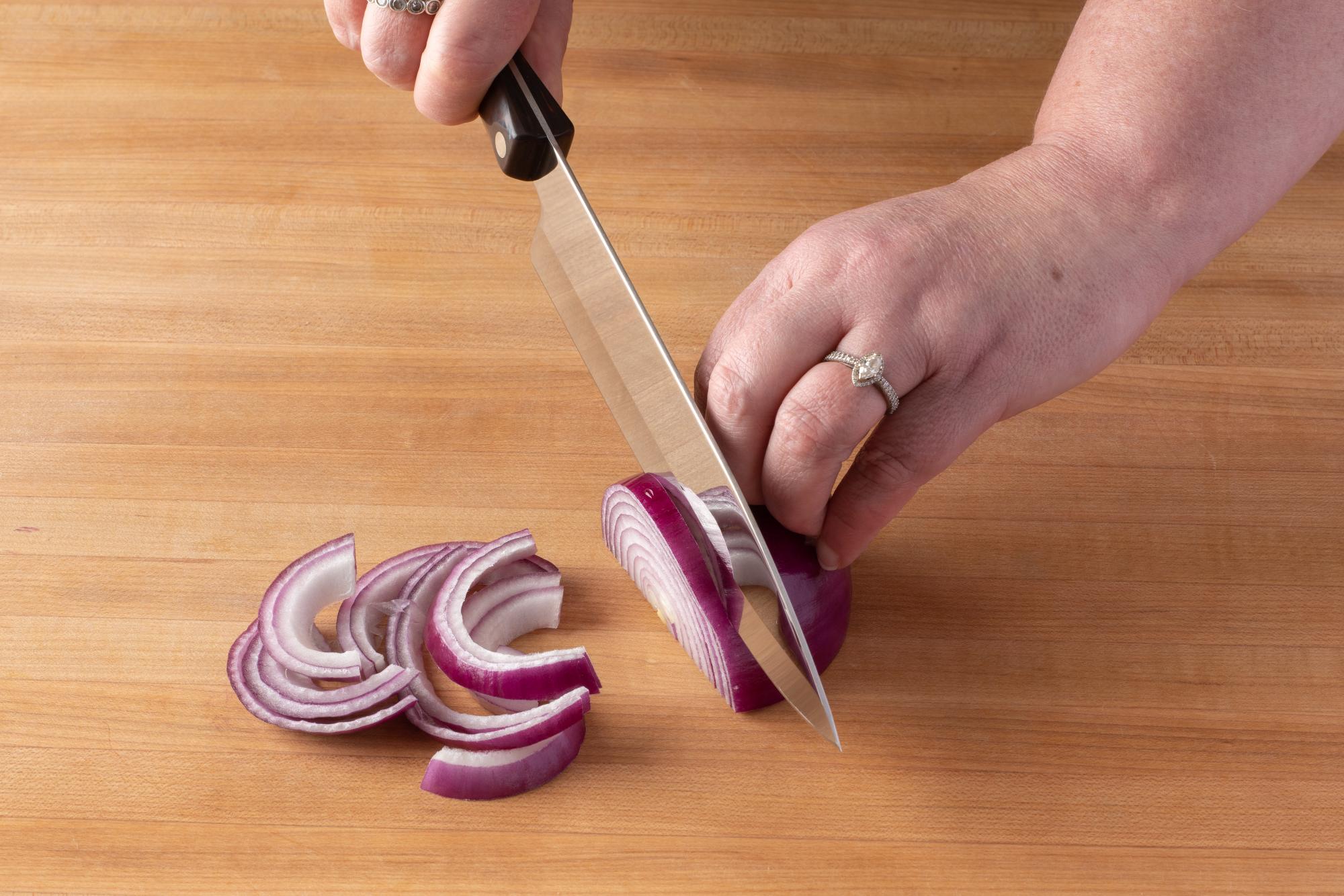 Slicing onion with a Petite Chef.