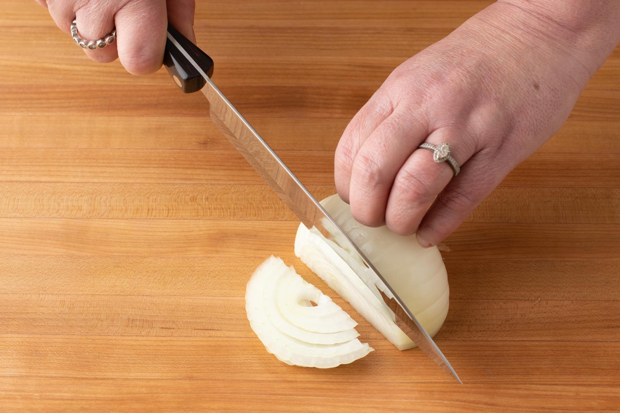 Slicing onion with a Petite Chef.