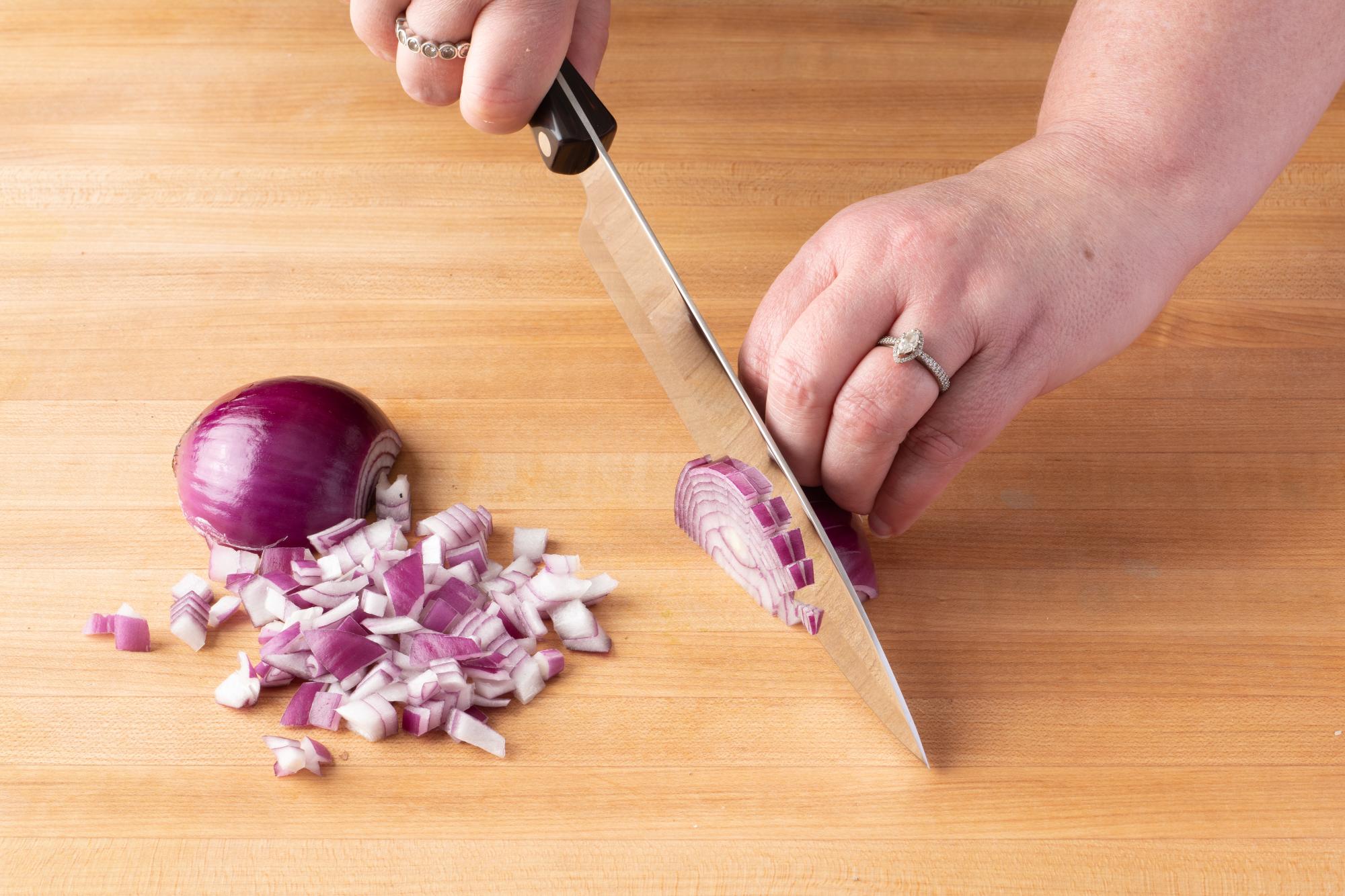 Chopping red onion with a Petite Chef.