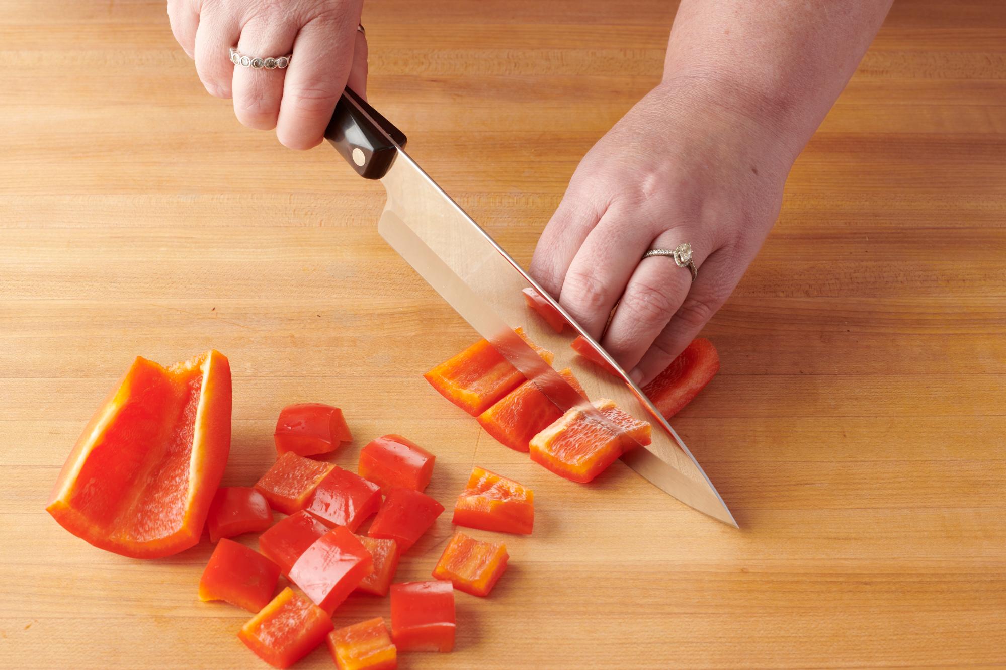 Cutting the red pepper with a Petite Chef.