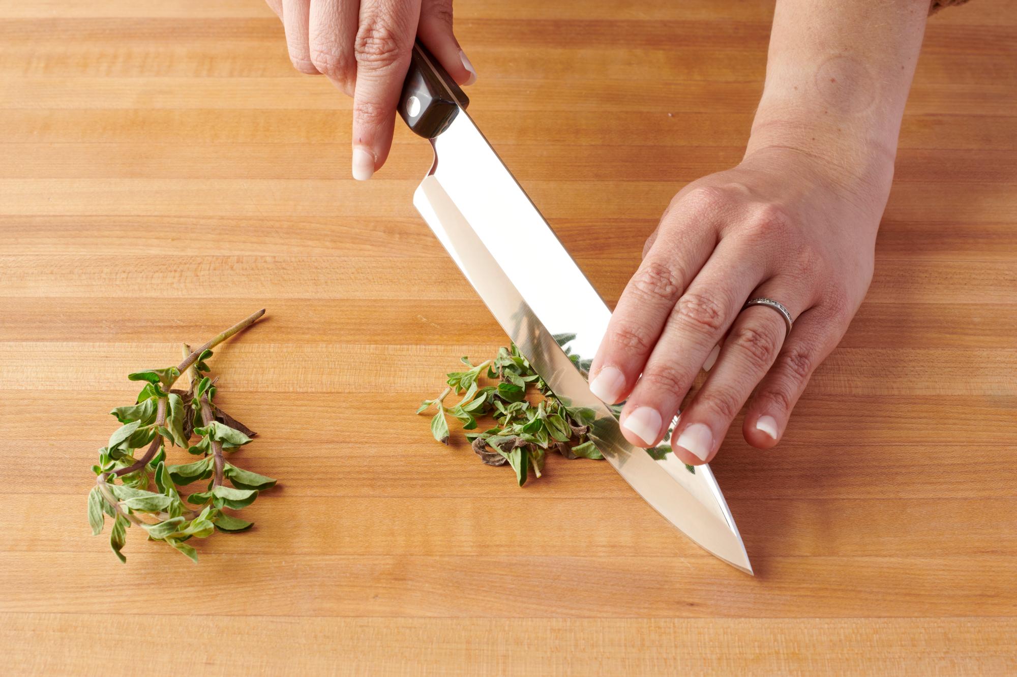 Using a Petite Chef to prepare the oregano.