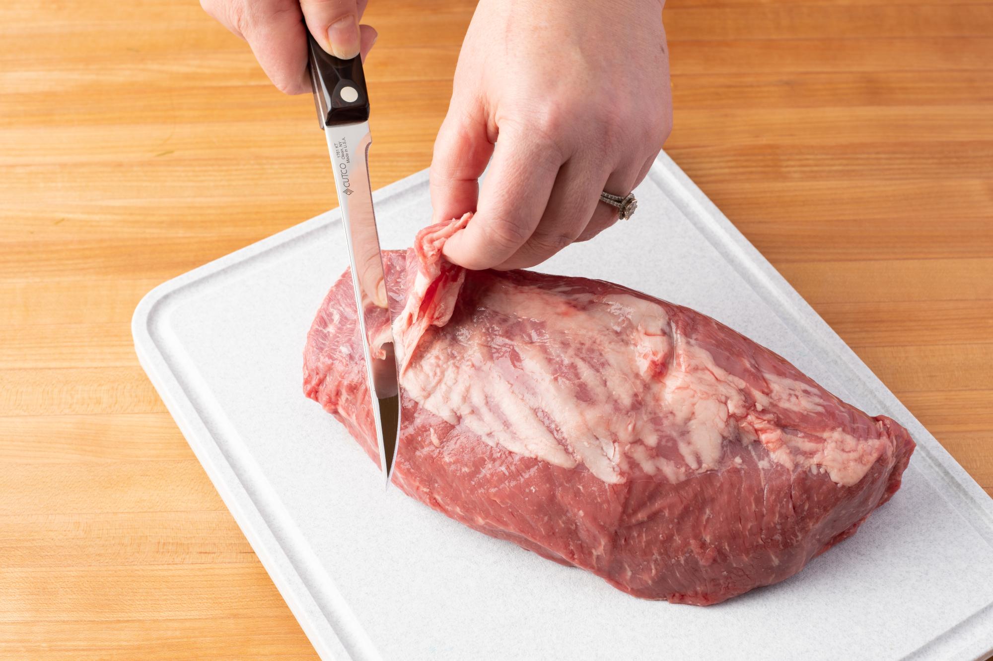 Use a Boning Knife to trim excess fat.