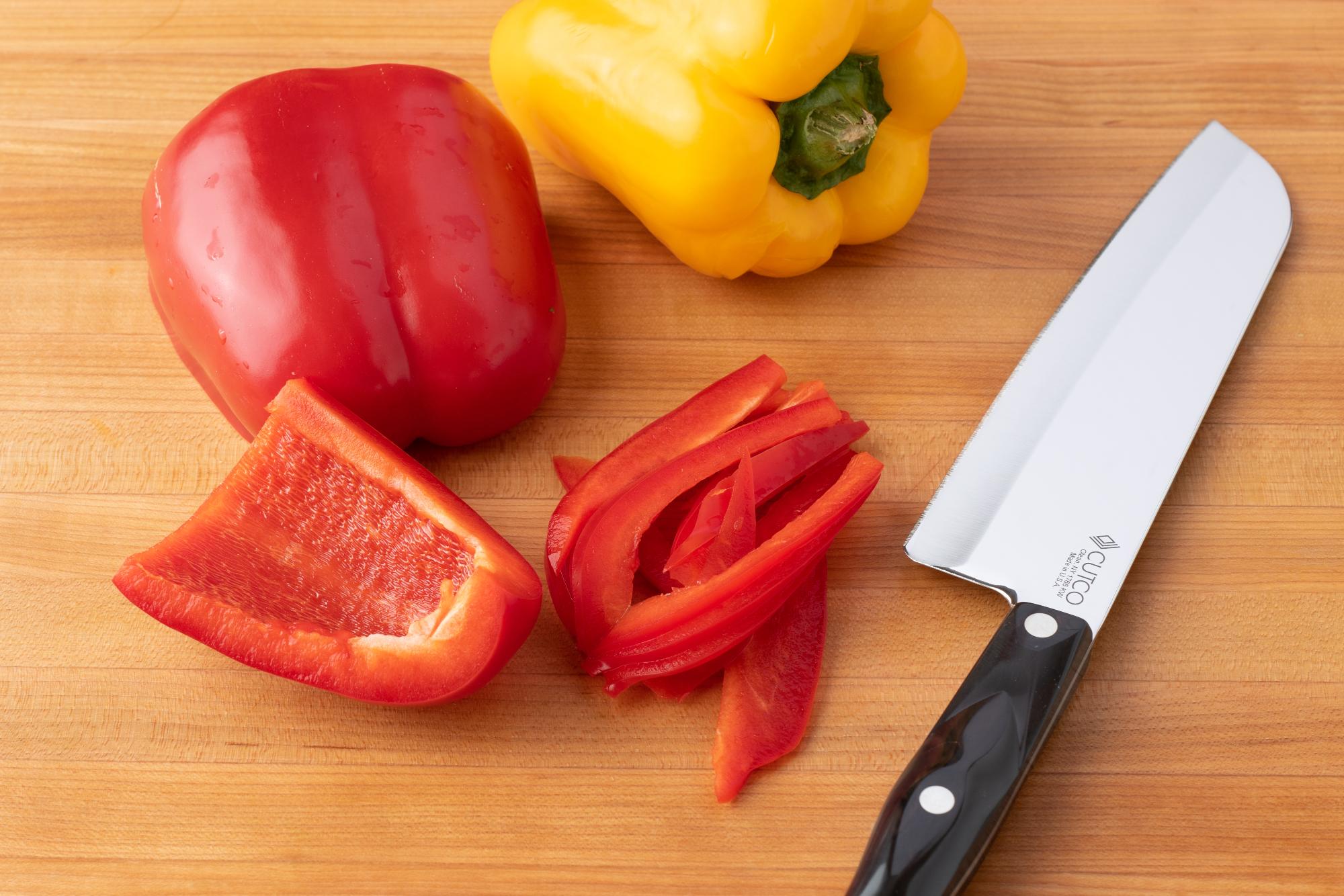 Using a Petite Santoku to slice the peppers.